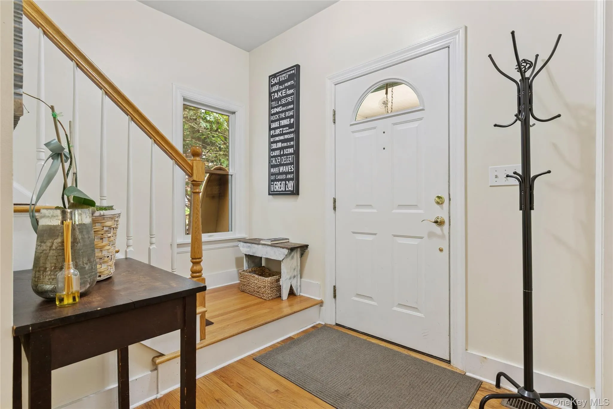 Foyer with light wood finished floors and stairway Foyer with light wood finished floors and stairway