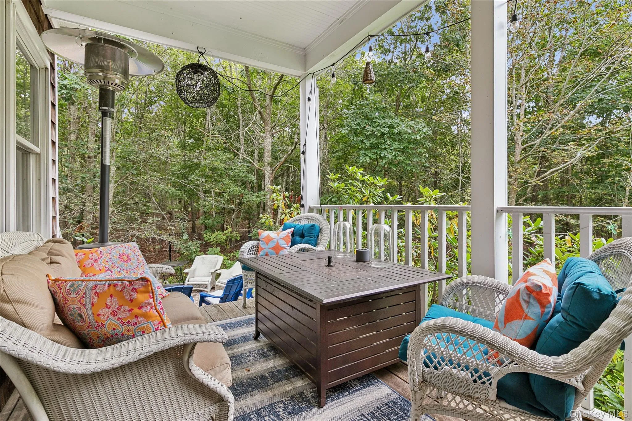 Deck featuring an outdoor hangout area and view of wooded area Deck featuring an outdoor hangout area and view of wooded area