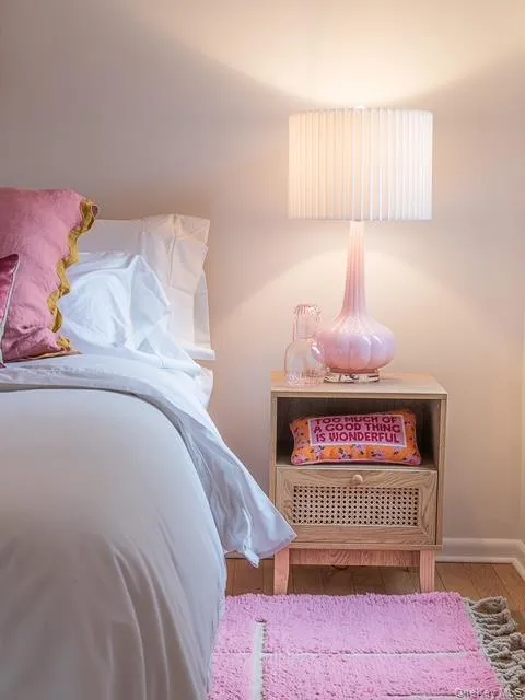 Bedroom with wood finished floors and baseboards Bedroom with wood finished floors and baseboards