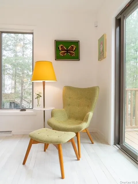 Living area with wood finished floors and baseboards Living area with wood finished floors and baseboards