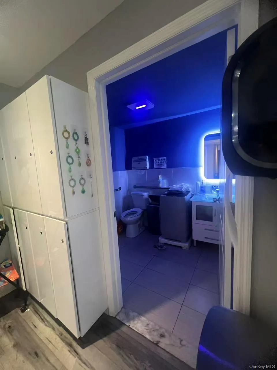 Kitchen with white cabinetry and dark tile patterned floors Kitchen with white cabinetry and dark tile patterned floors