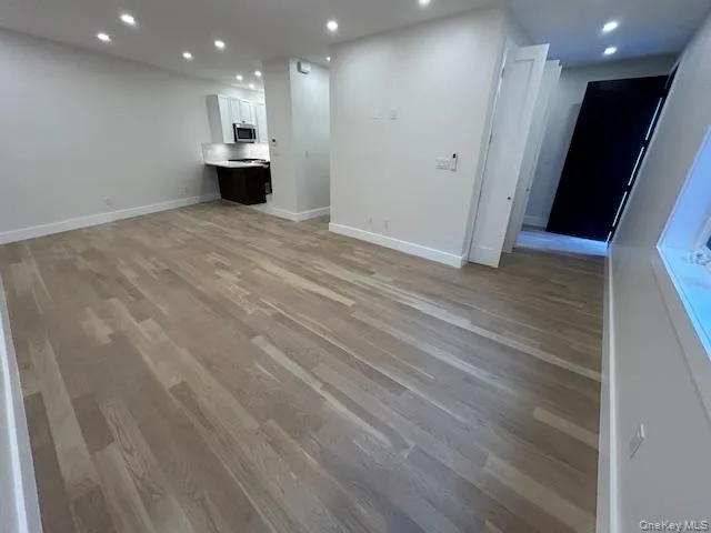 Unfurnished living room with recessed lighting and light wood finished floors Unfurnished living room with recessed lighting and light wood finished floors