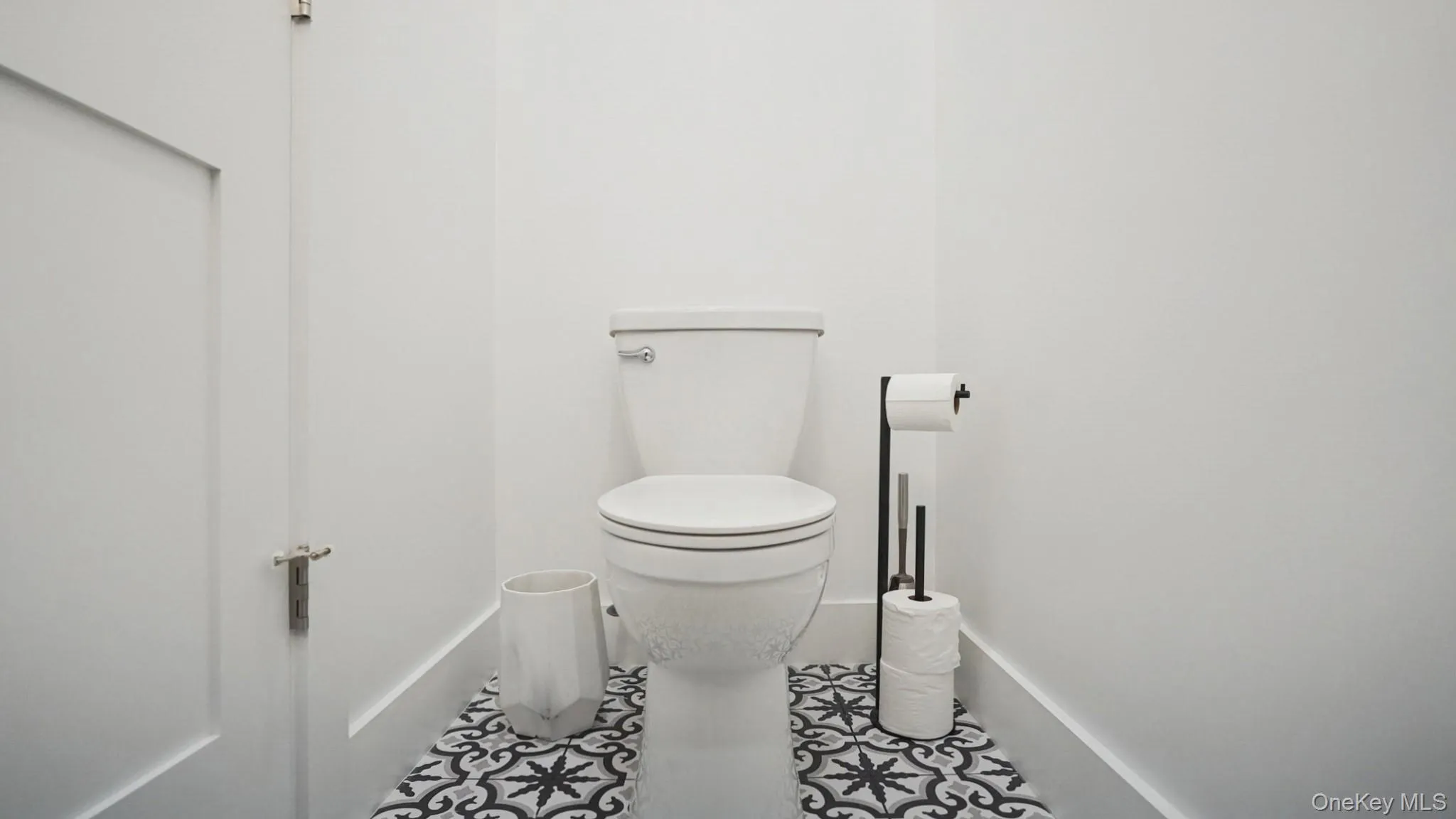 Half bathroom with toilet and tile patterned floors Half bathroom with toilet and tile patterned floors