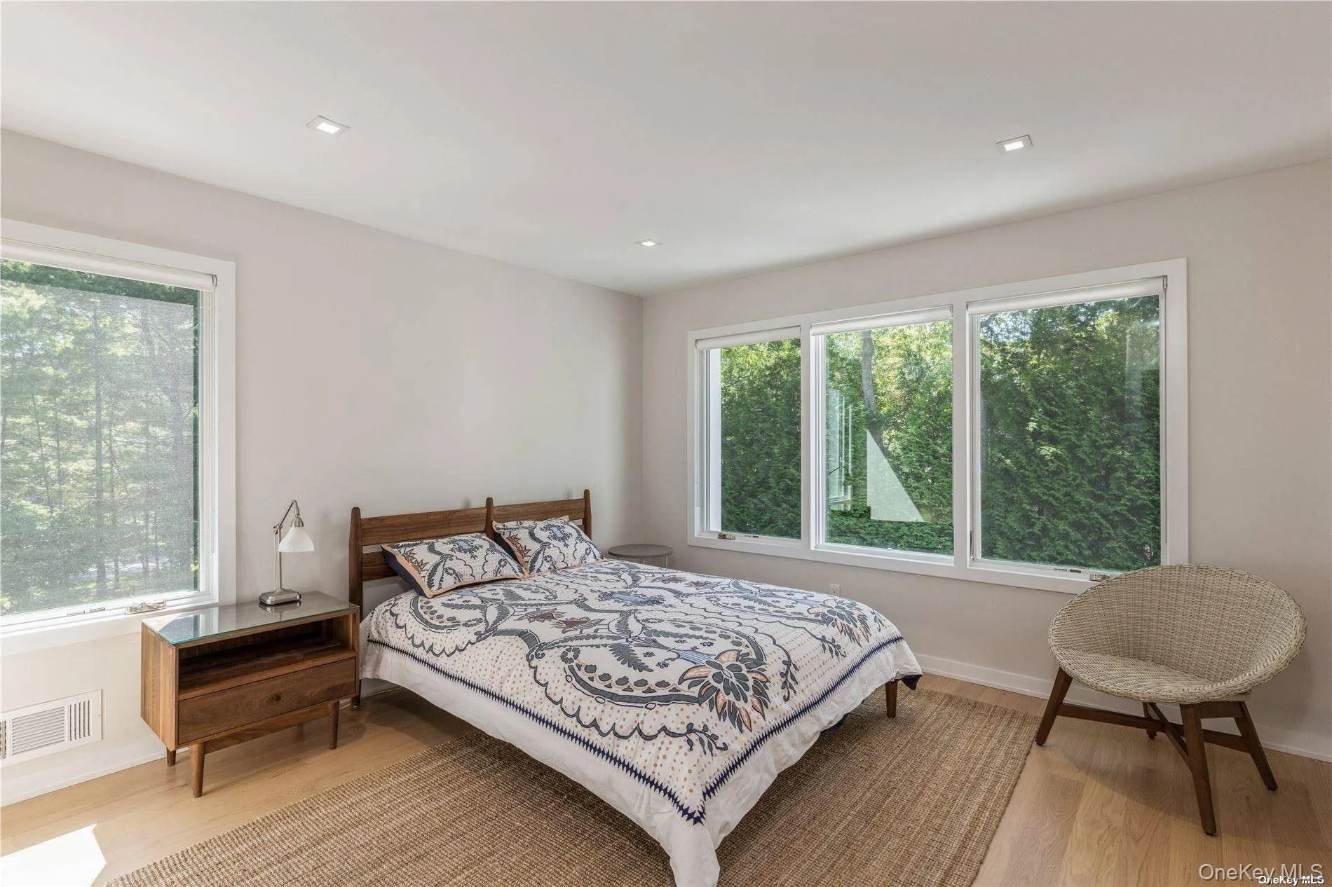 Bedroom featuring light wood finished floors and recessed lighting Bedroom featuring light wood finished floors and recessed lighting
