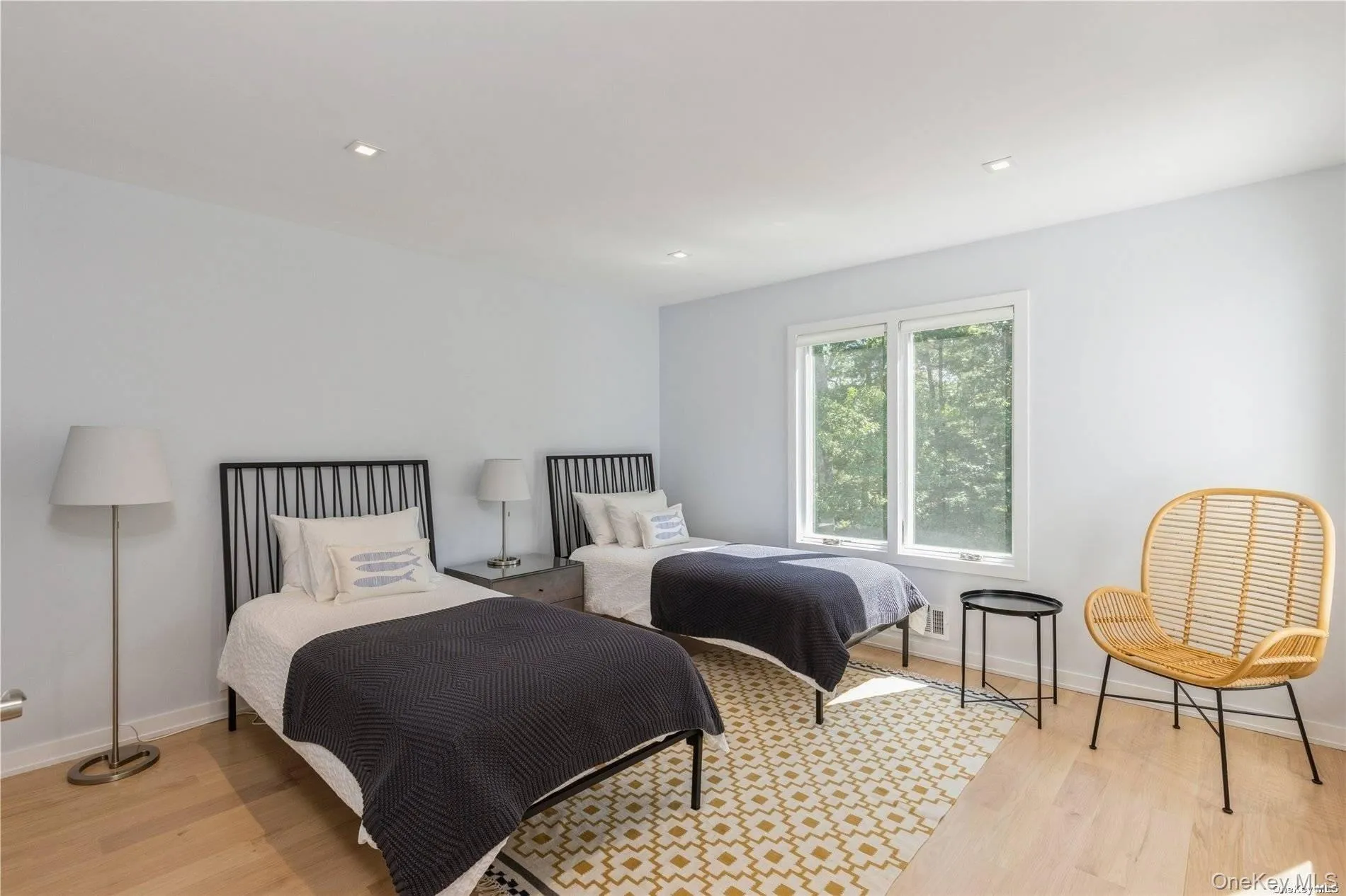 Bedroom featuring light wood-type flooring and recessed lighting Bedroom featuring light wood-type flooring and recessed lighting
