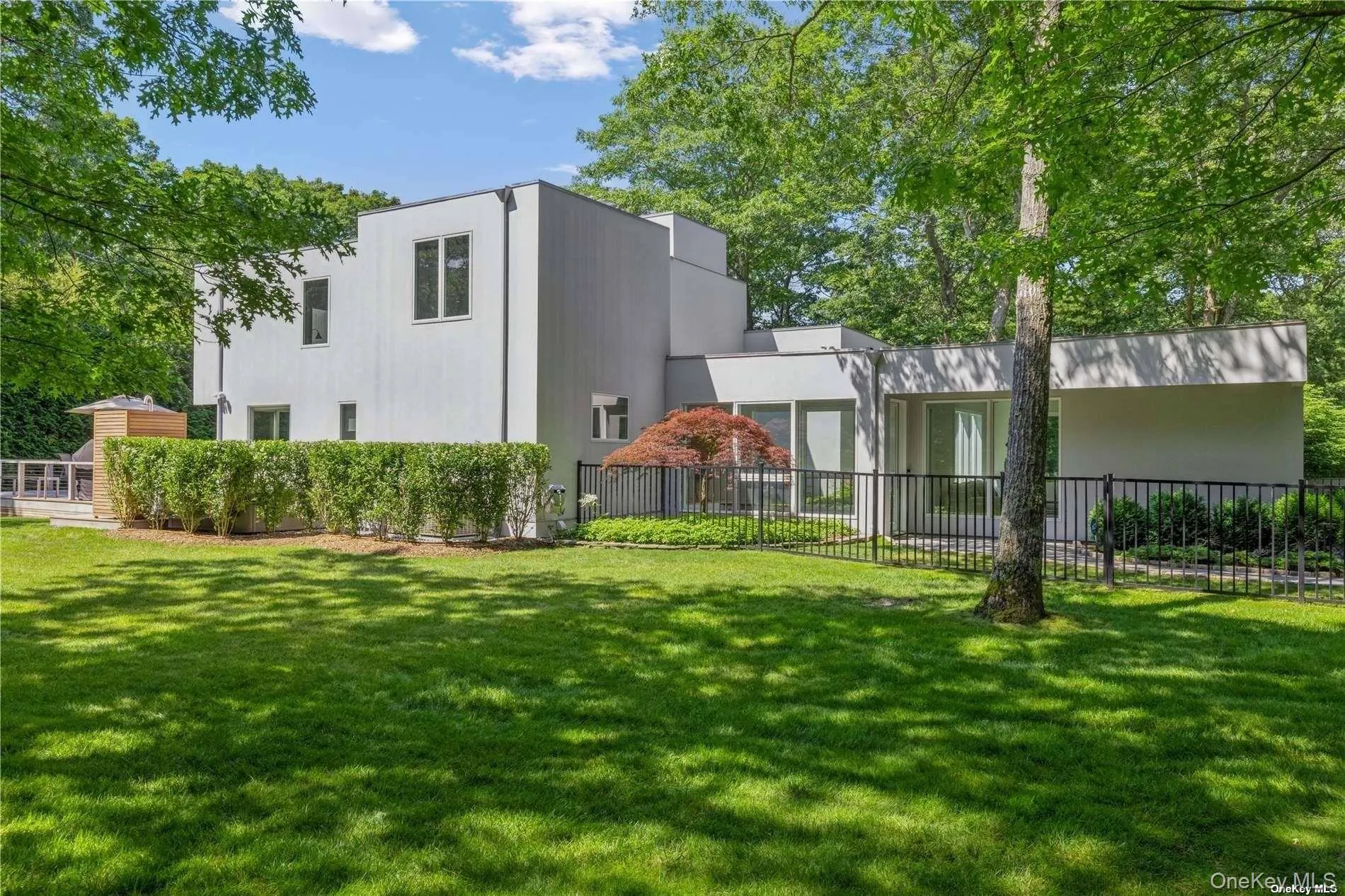 Back of property with stucco siding Back of property with stucco siding