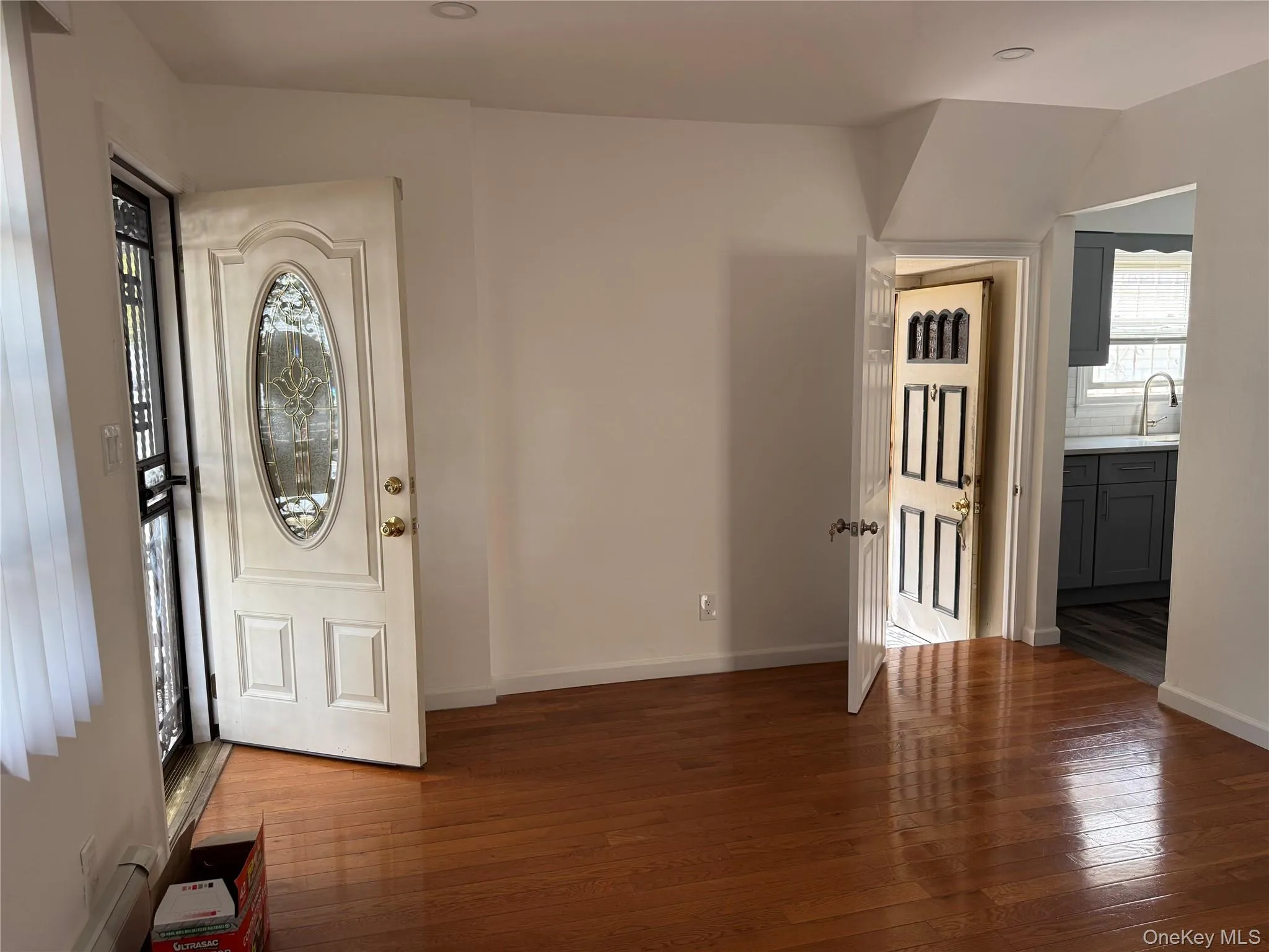 Entrance foyer with dark wood-type flooring and recessed lighting Entrance foyer with dark wood-type flooring and recessed lighting
