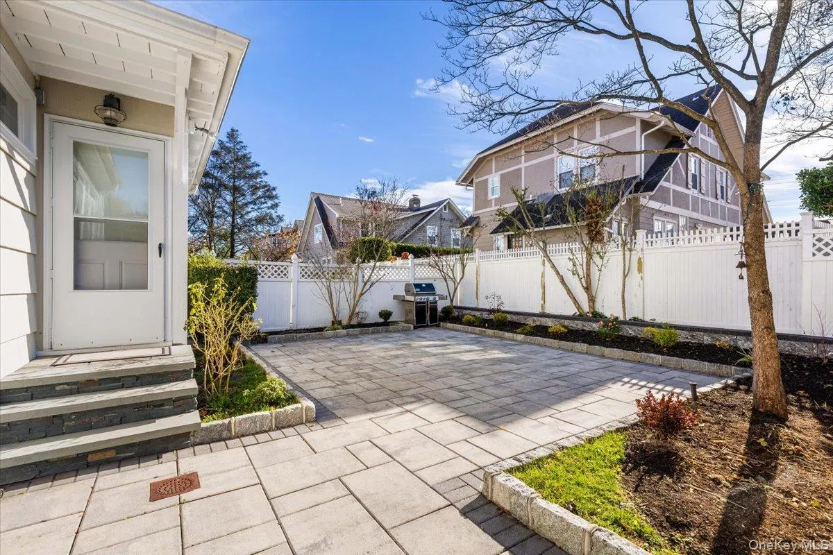 Fenced backyard featuring a patio area and grilling area Fenced backyard featuring a patio area and grilling area