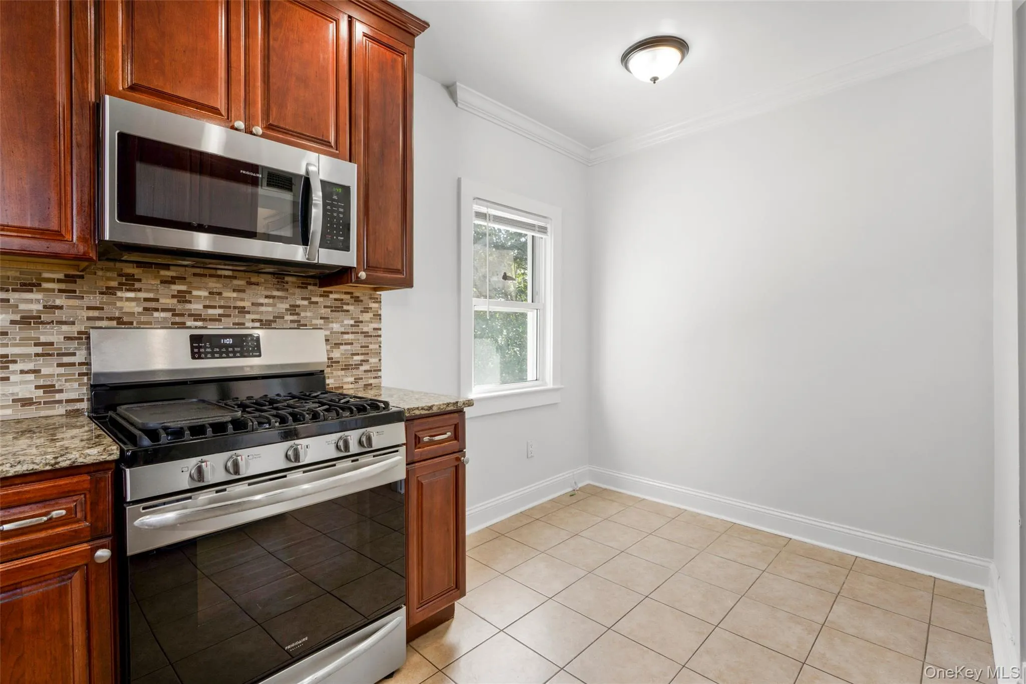 Stainless steel appliances and dining area Stainless steel appliances and dining area