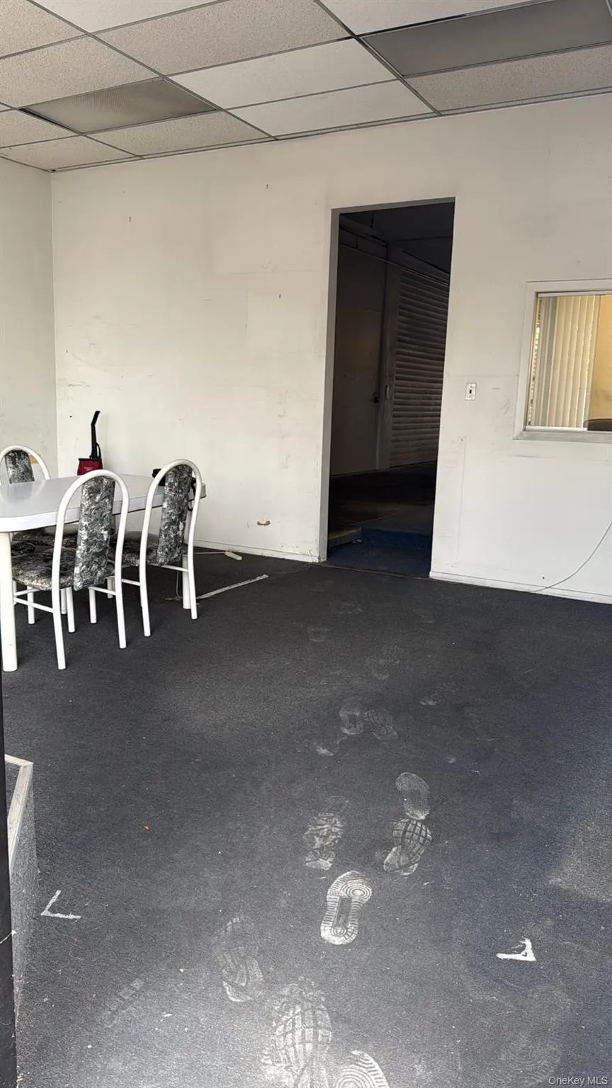 Unfurnished dining area featuring a paneled ceiling Unfurnished dining area featuring a paneled ceiling