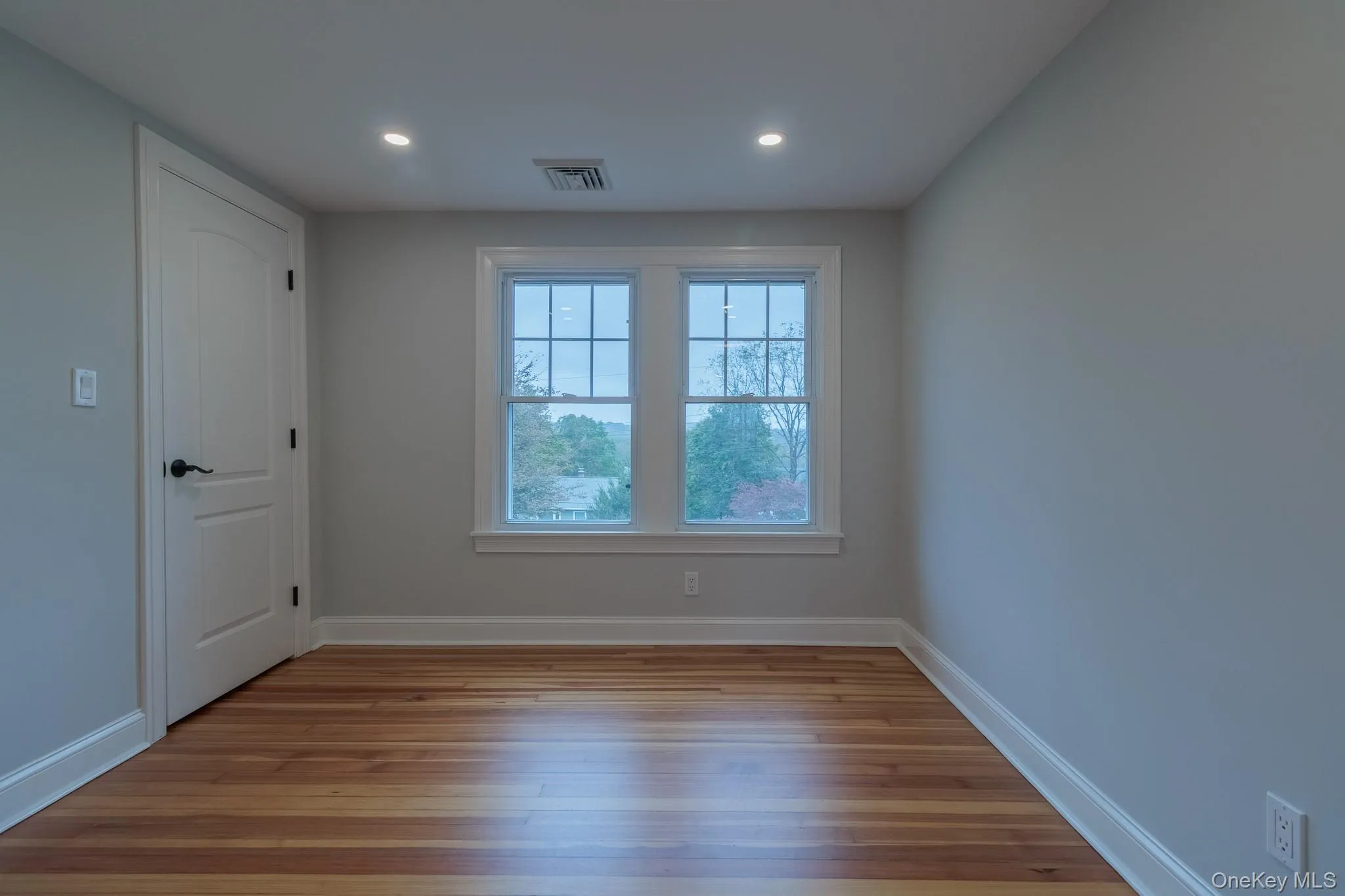 Spare room featuring light wood-type flooring and recessed lighting Spare room featuring light wood-type flooring and recessed lighting