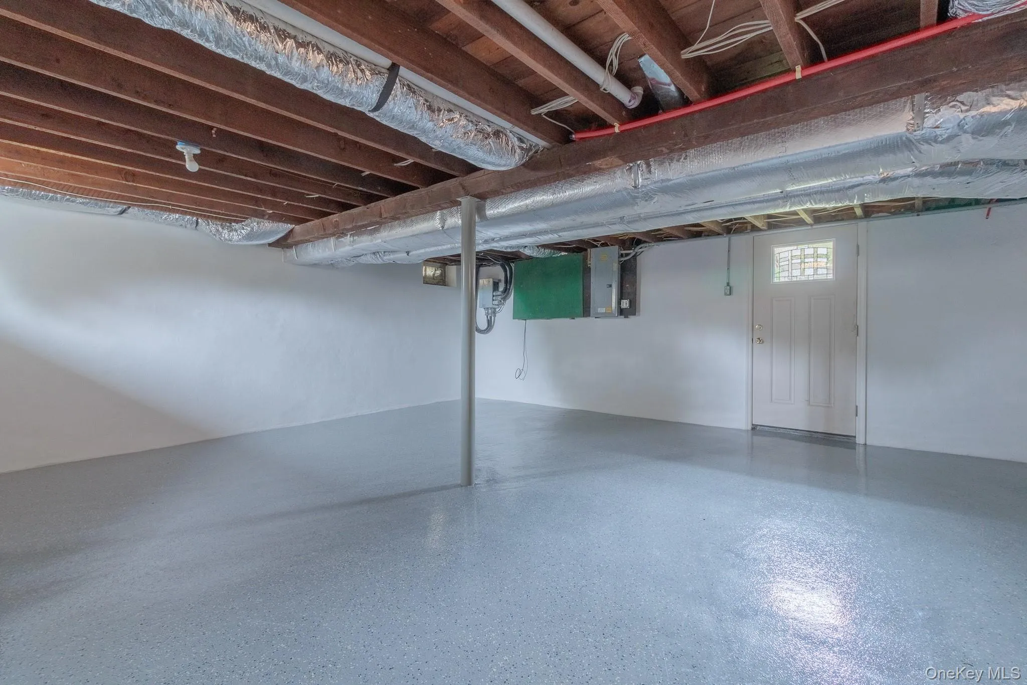 Basement featuring electric panel Basement featuring electric panel