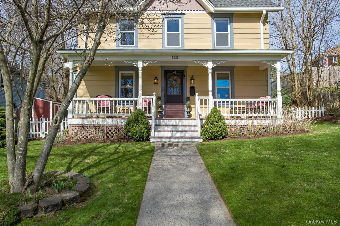 View of front of house featuring covered porch and a shingled roof View of front of house featuring covered porch and a shingled roof