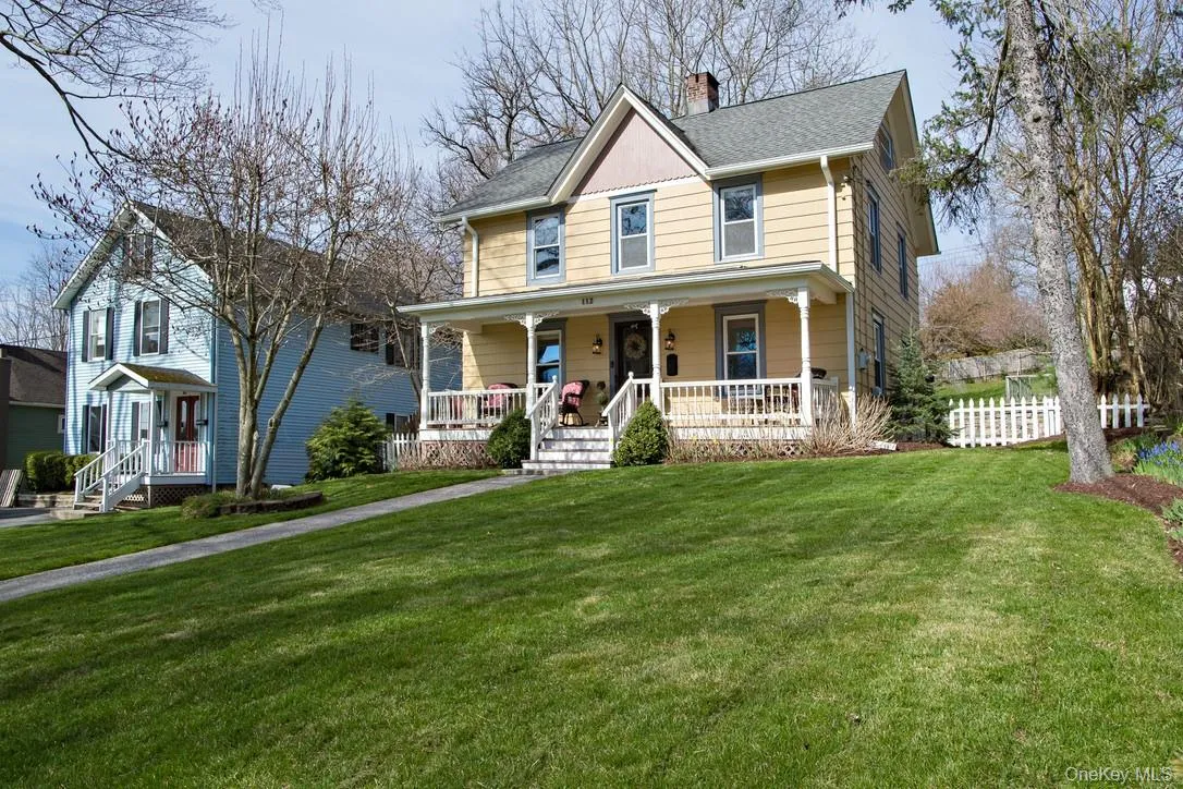 View of front of house featuring a chimney, covered porch, and a shingled roof View of front of house featuring a chimney, covered porch, and a shingled roof