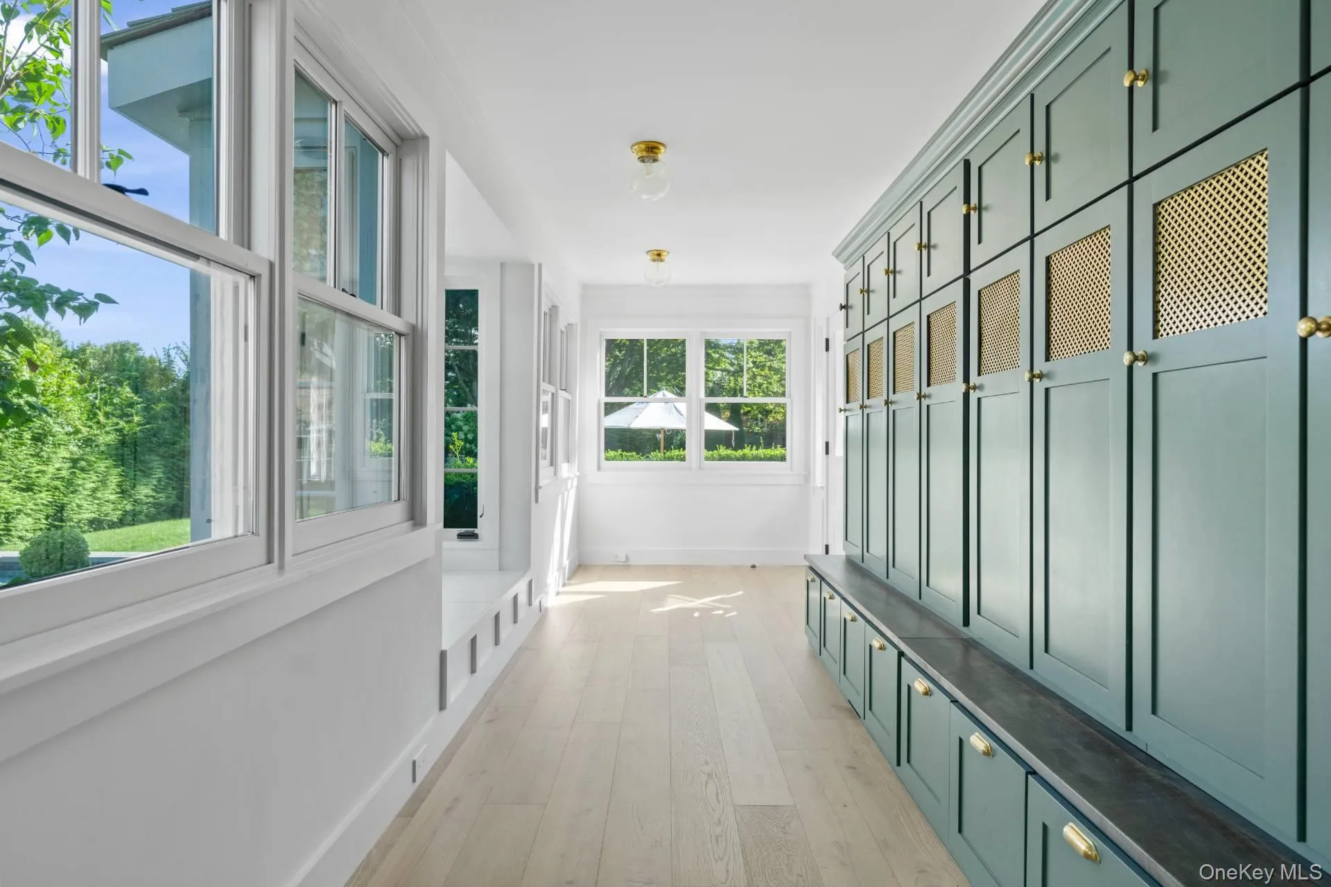 Mudroom with light wood-style flooring and baseboards Mudroom with light wood-style flooring and baseboards