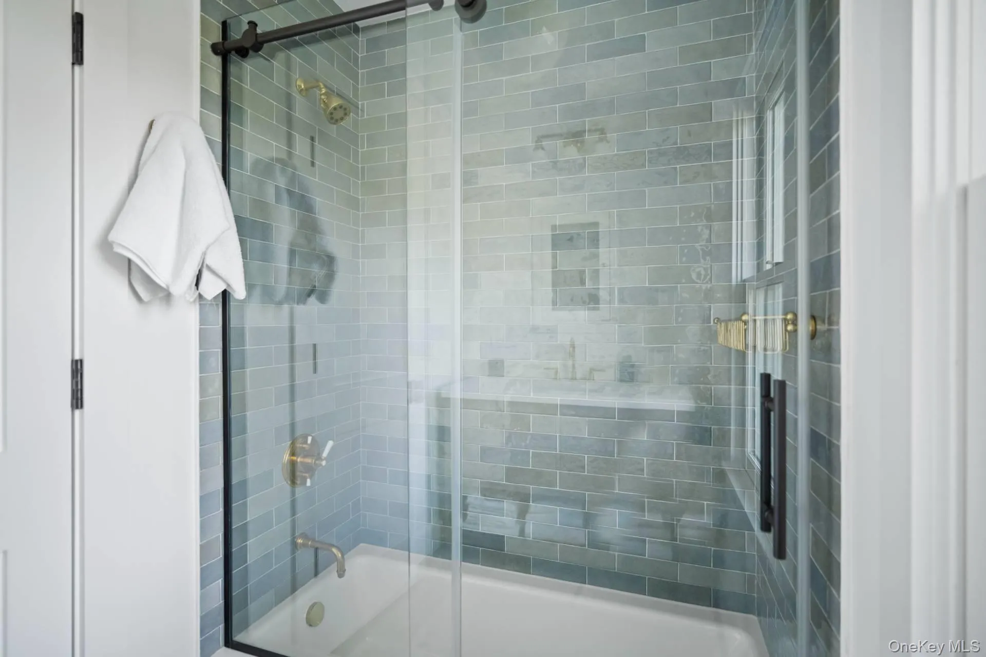 Bathroom featuring enclosed tub / shower combo Bathroom featuring enclosed tub / shower combo