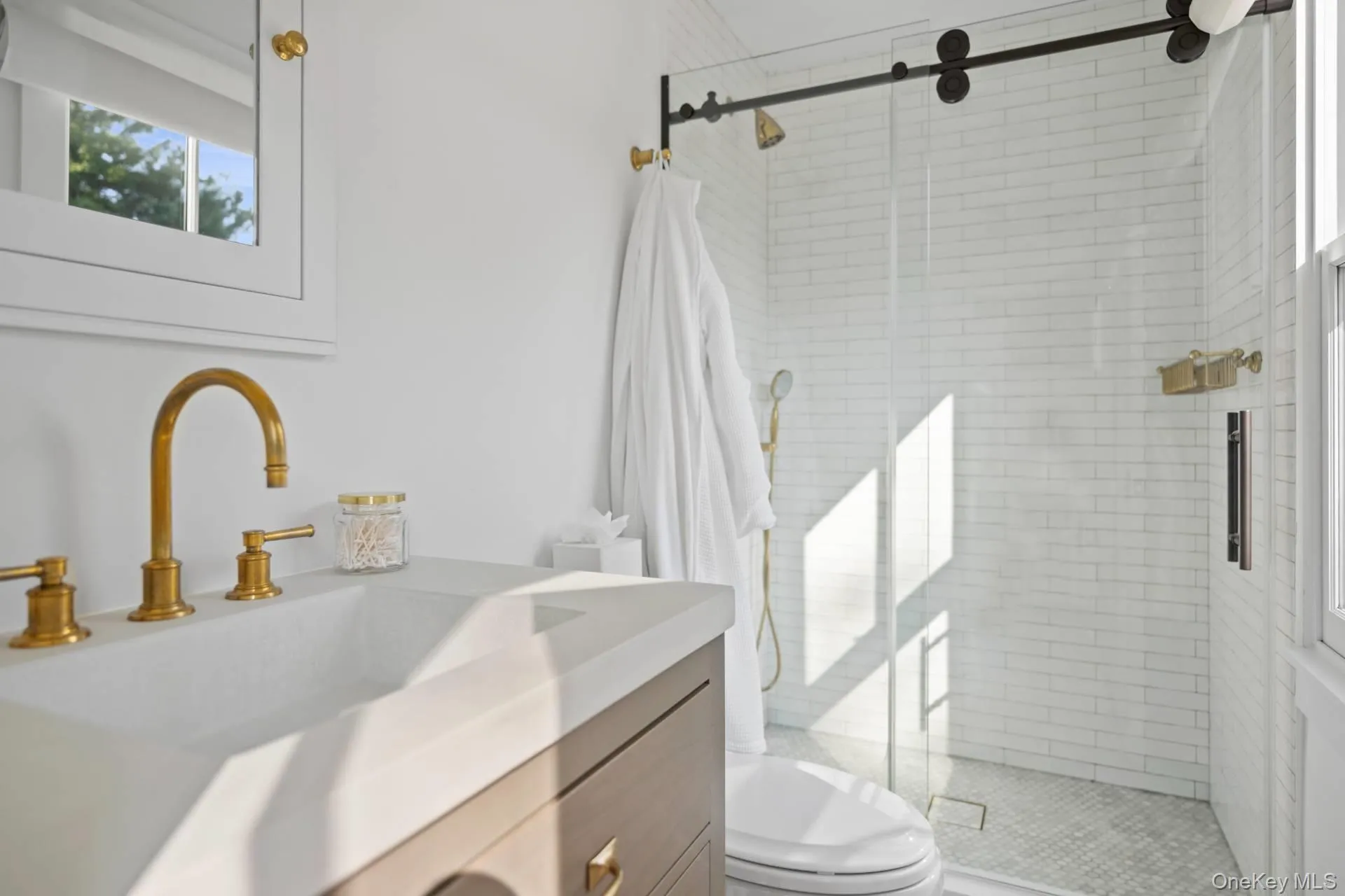 Full bath featuring vanity and a shower stall Full bath featuring vanity and a shower stall
