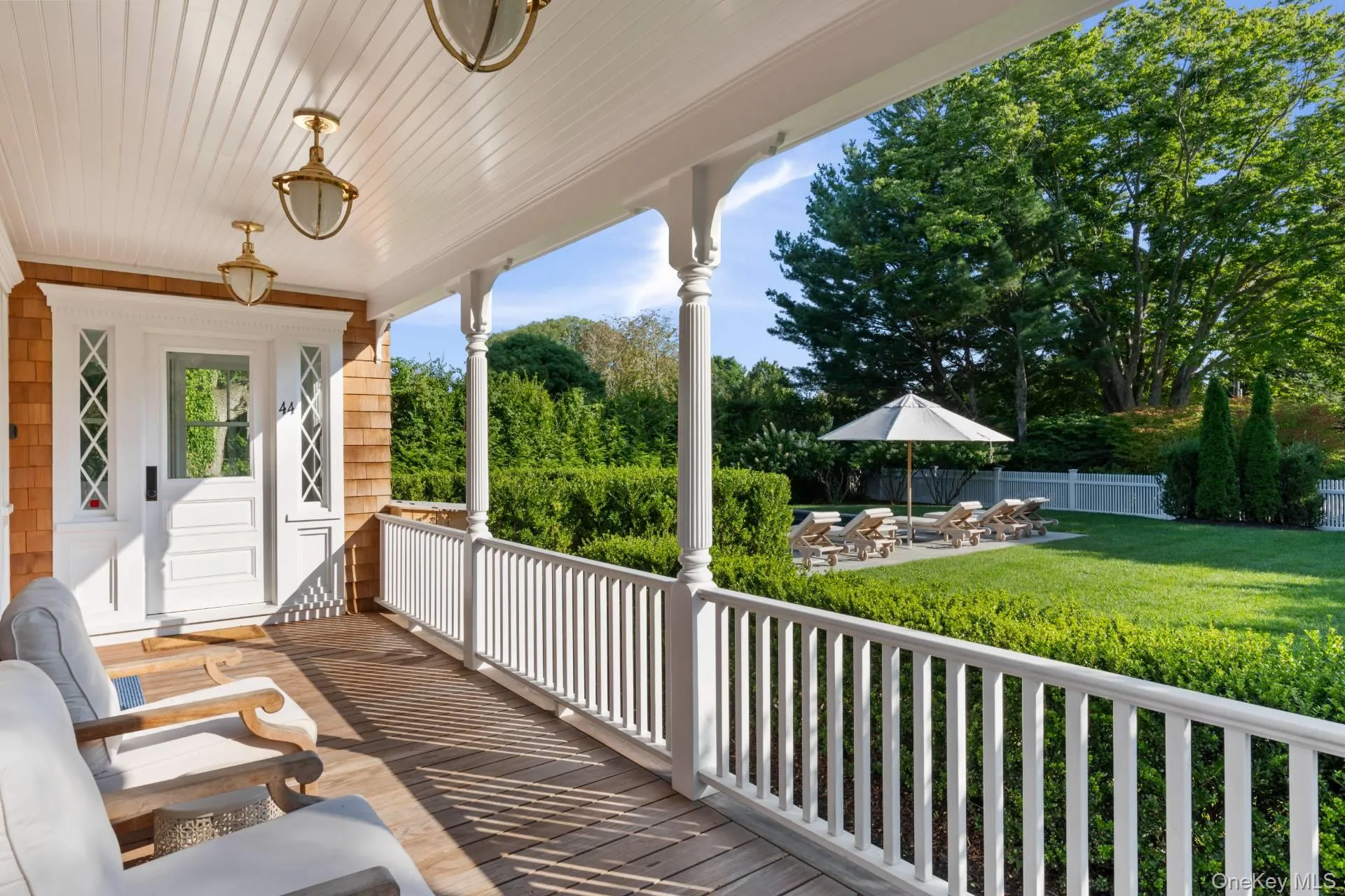 Porch featuring a patio, a fenced backyard, and view of wooded area Porch featuring a patio, a fenced backyard, and view of wooded area