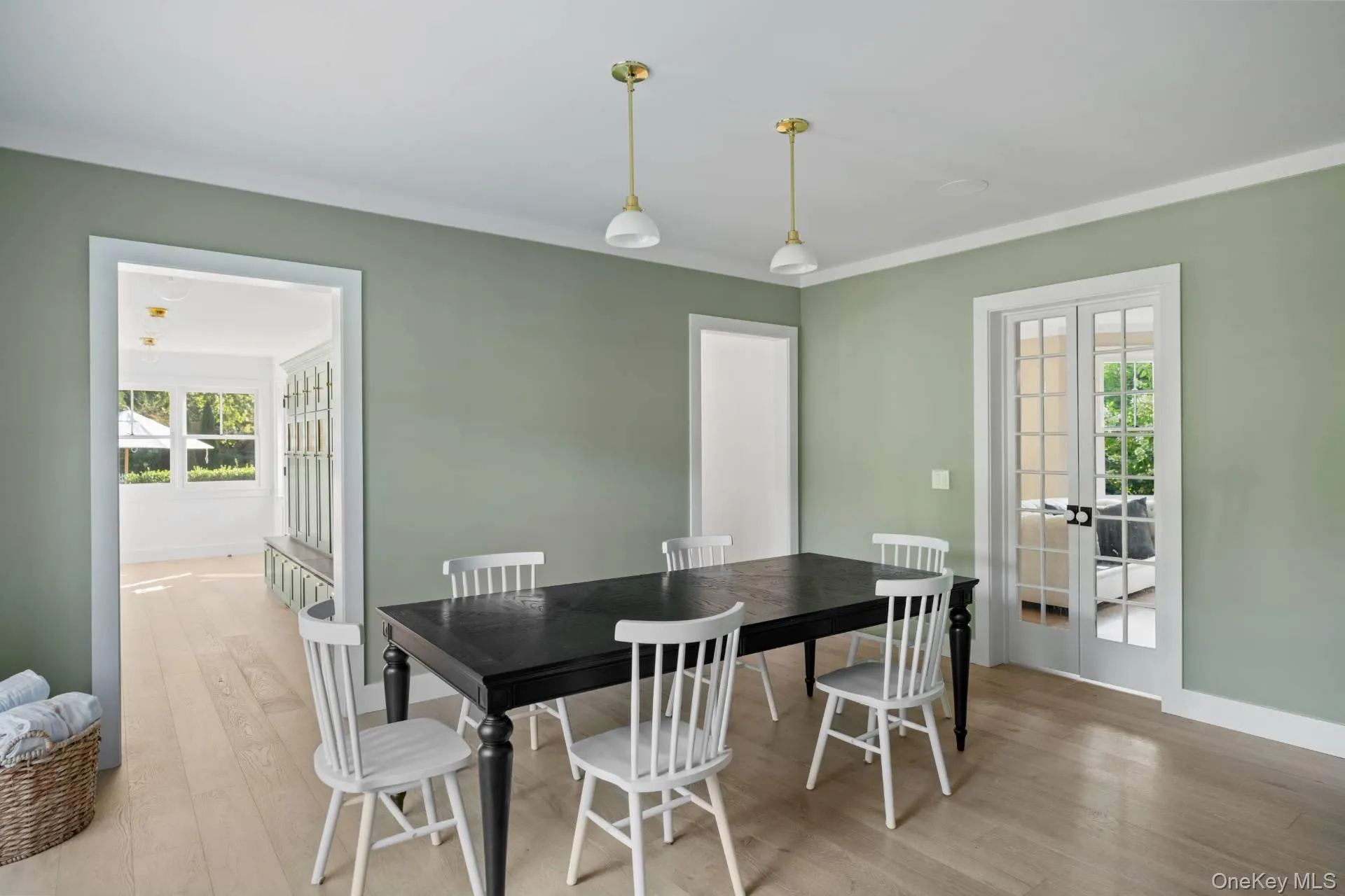 Dining area with wood finished floors, french doors, healthy amount of natural light, and crown molding Dining area with wood finished floors, french doors, healthy amount of natural light, and crown molding