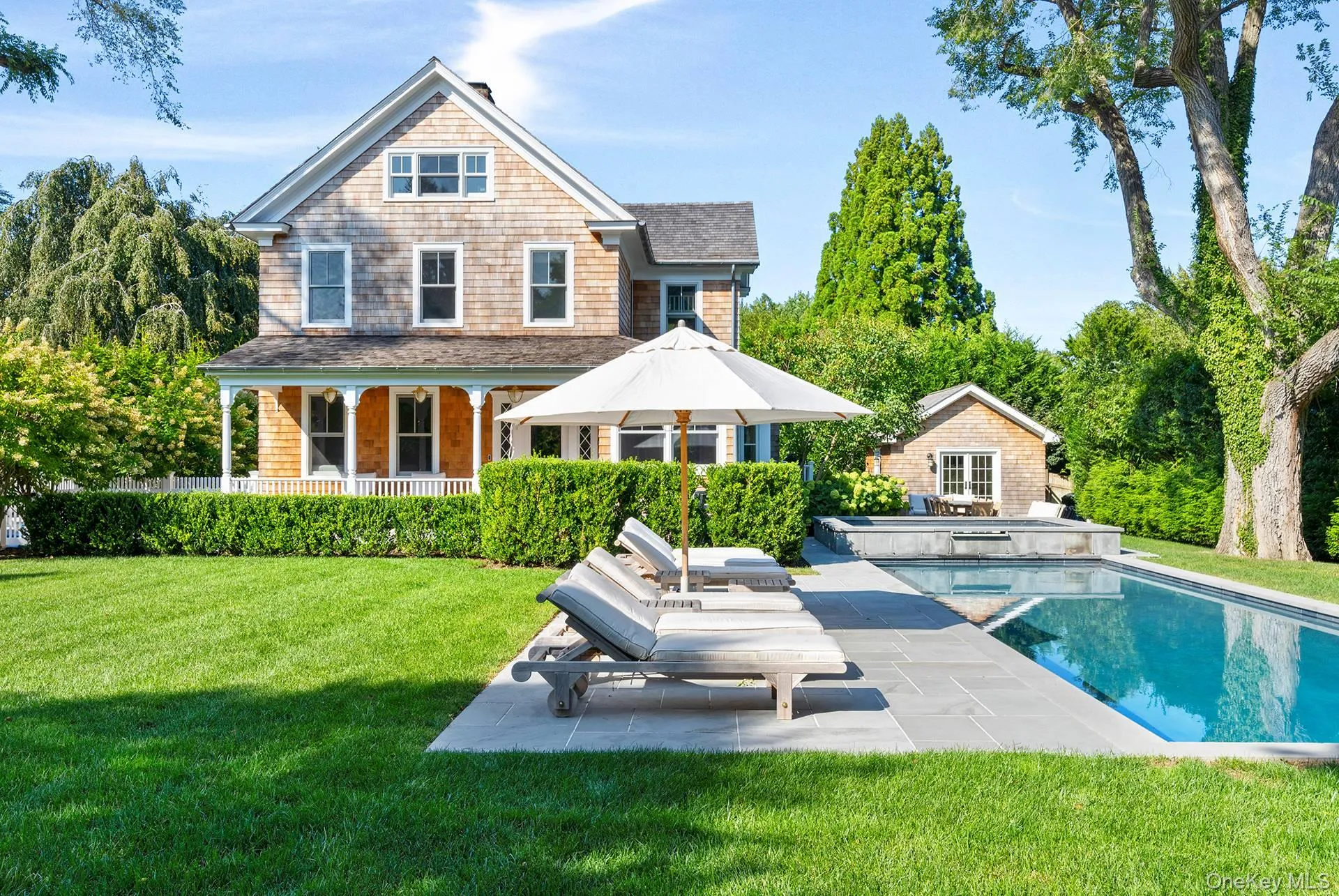 Rear view of property featuring a storage structure, an outdoor structure, a yard, and a patio area Rear view of property featuring a storage structure, an outdoor structure, a yard, and a patio area