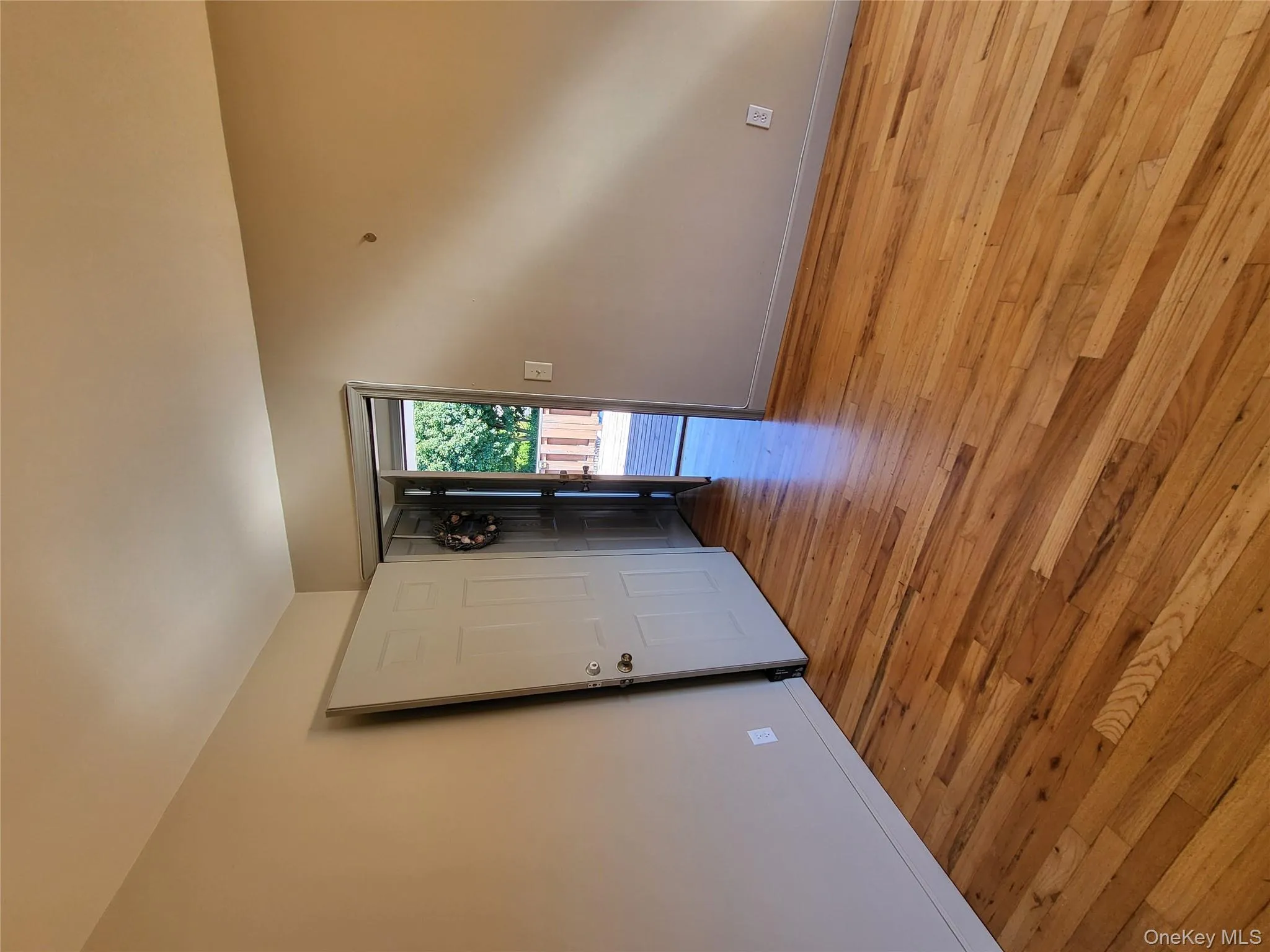 Spare room with light wood finished floors and baseboards Spare room with light wood finished floors and baseboards