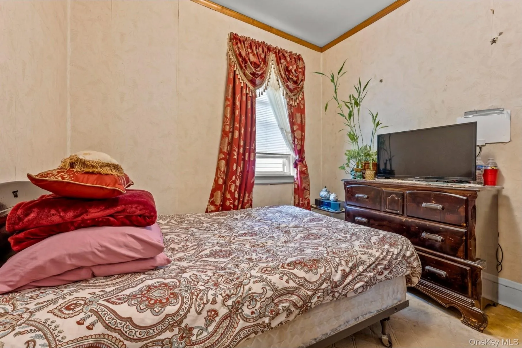 Bedroom featuring crown molding Bedroom featuring crown molding