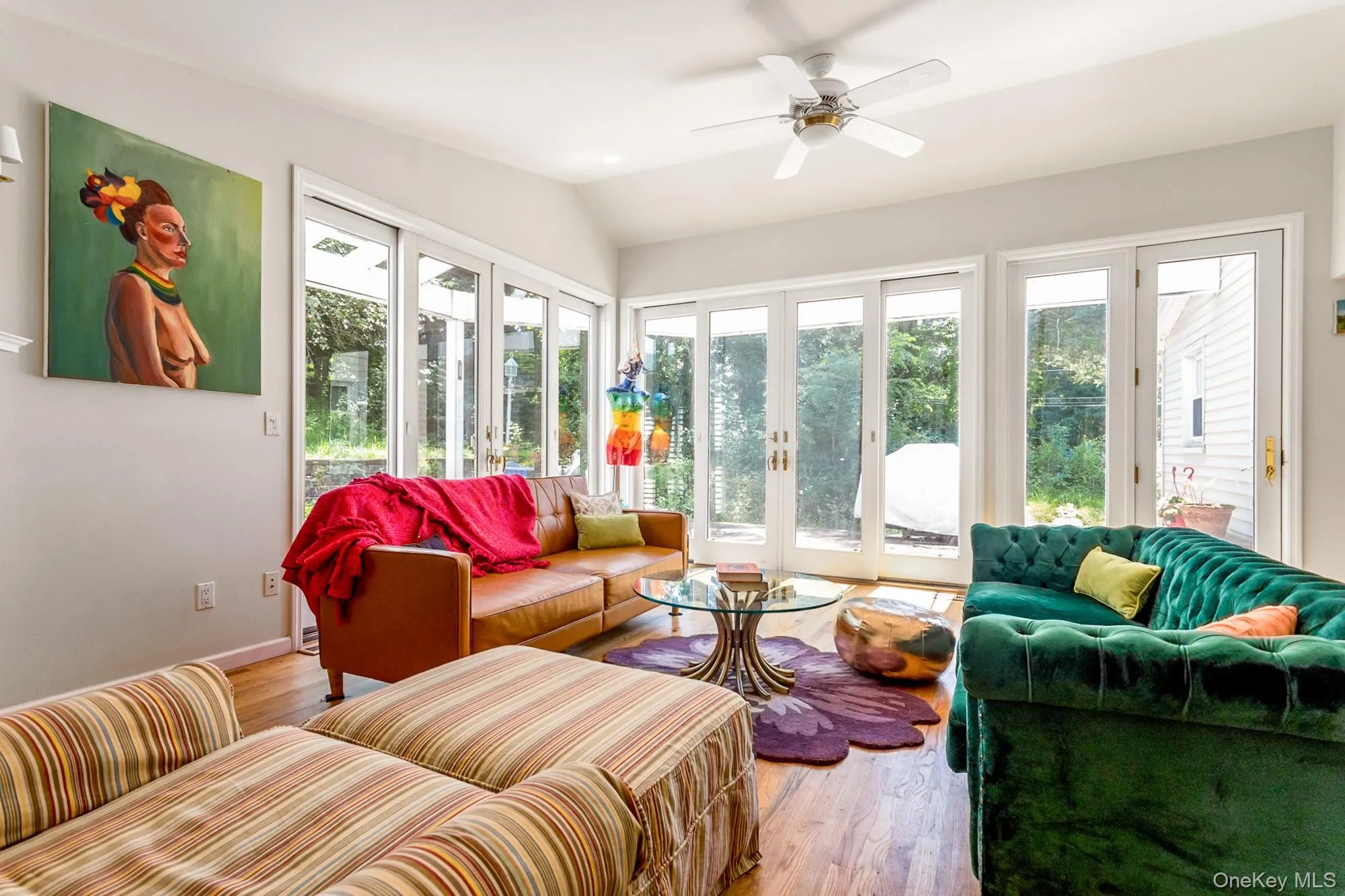 Sunroom featuring french doors and vaulted ceiling Sunroom featuring french doors and vaulted ceiling