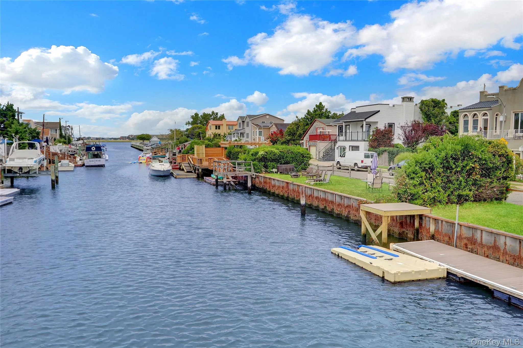 Dock with a water view and a residential view Dock with a water view and a residential view