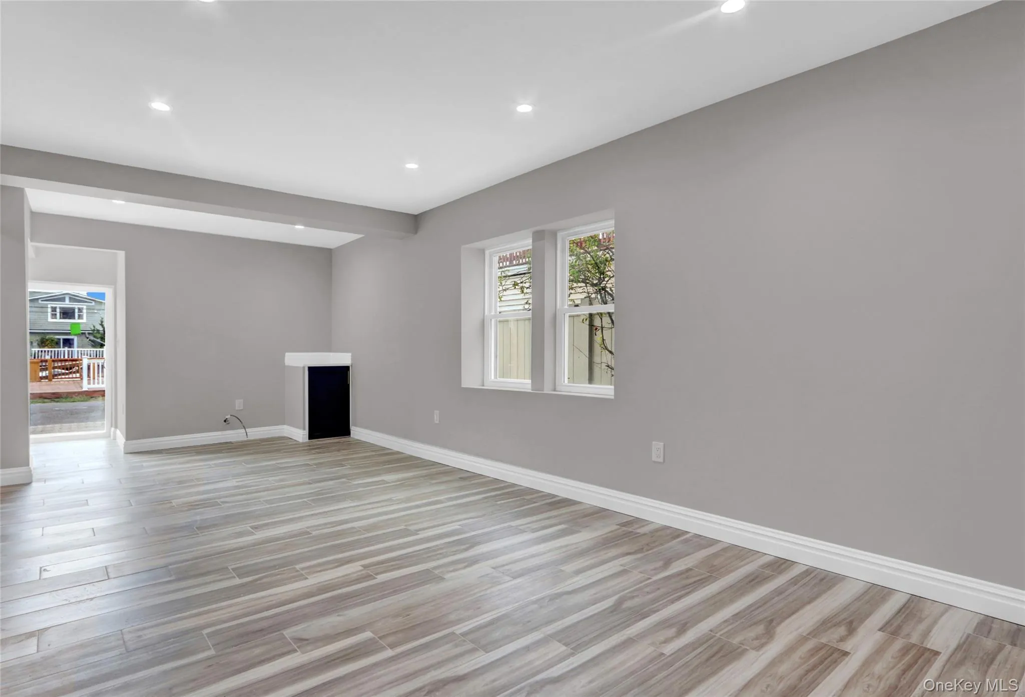 Unfurnished living room with recessed lighting and light wood finished floors Unfurnished living room with recessed lighting and light wood finished floors