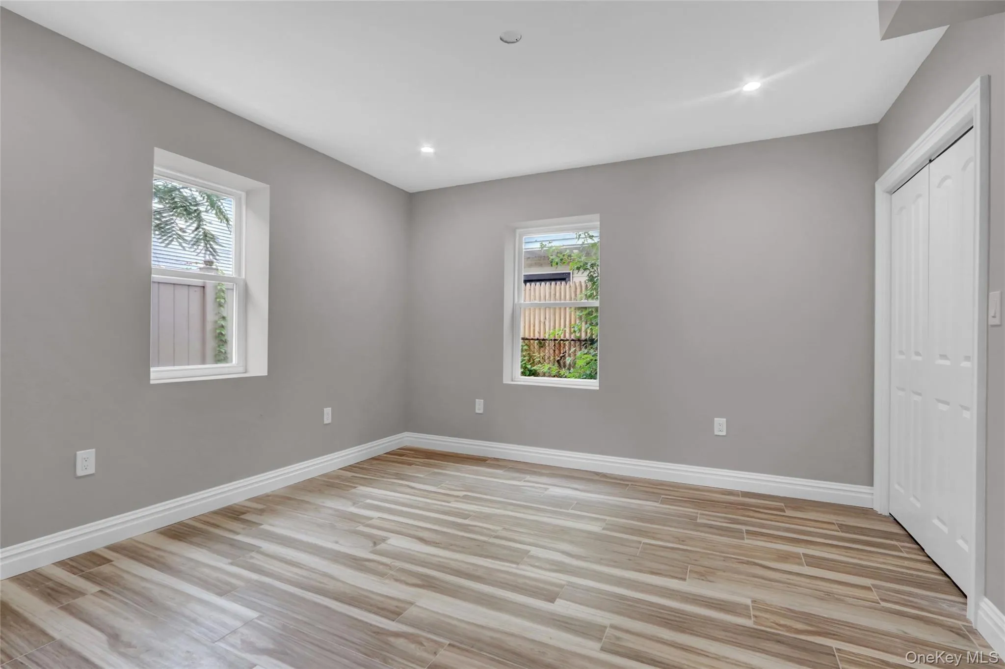 Unfurnished bedroom featuring light wood finished floors, a closet, and recessed lighting Unfurnished bedroom featuring light wood finished floors, a closet, and recessed lighting
