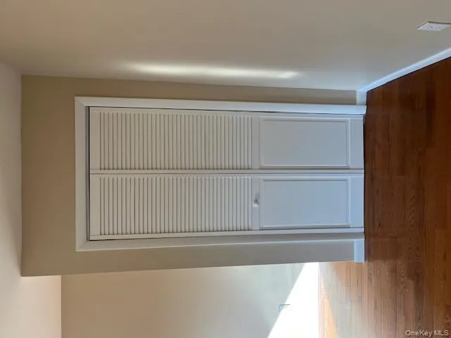 Detailed view of baseboards and wood finished floors Detailed view of baseboards and wood finished floors