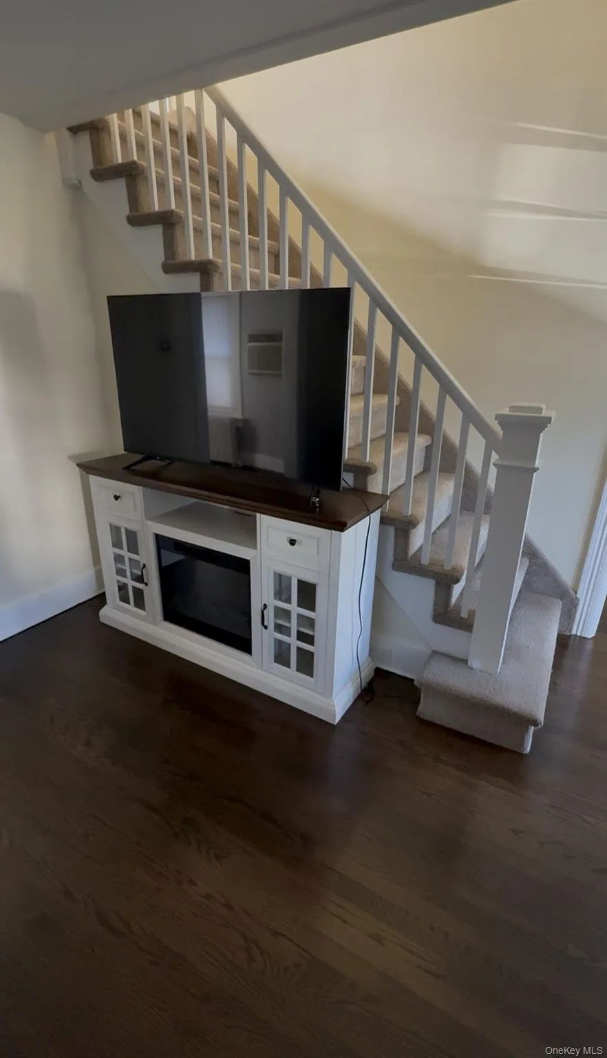 Stairs with wood finished floors and baseboards Stairs with wood finished floors and baseboards