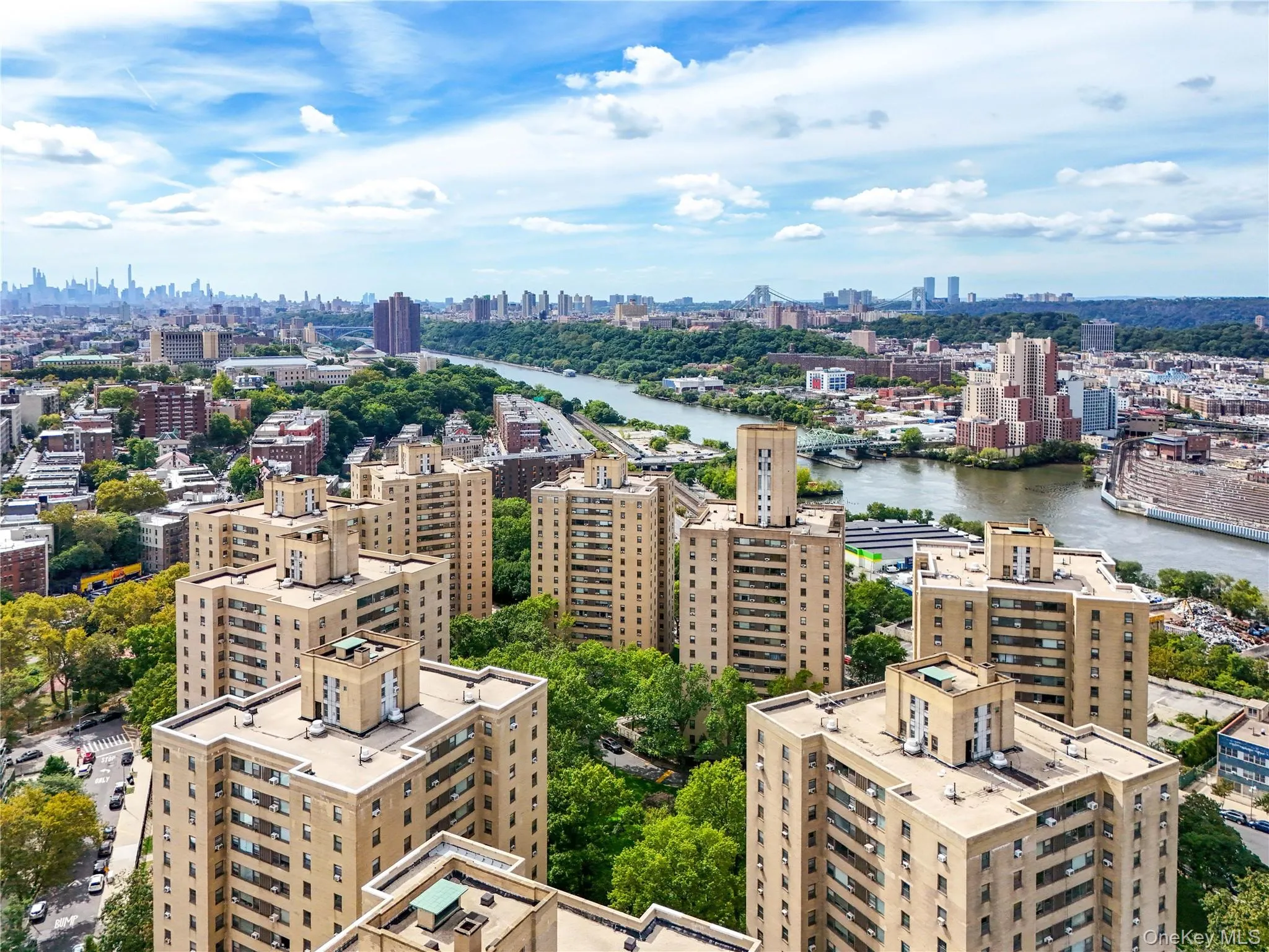 Bird's eye view of skyline and a large body of water Bird's eye view of skyline and a large body of water