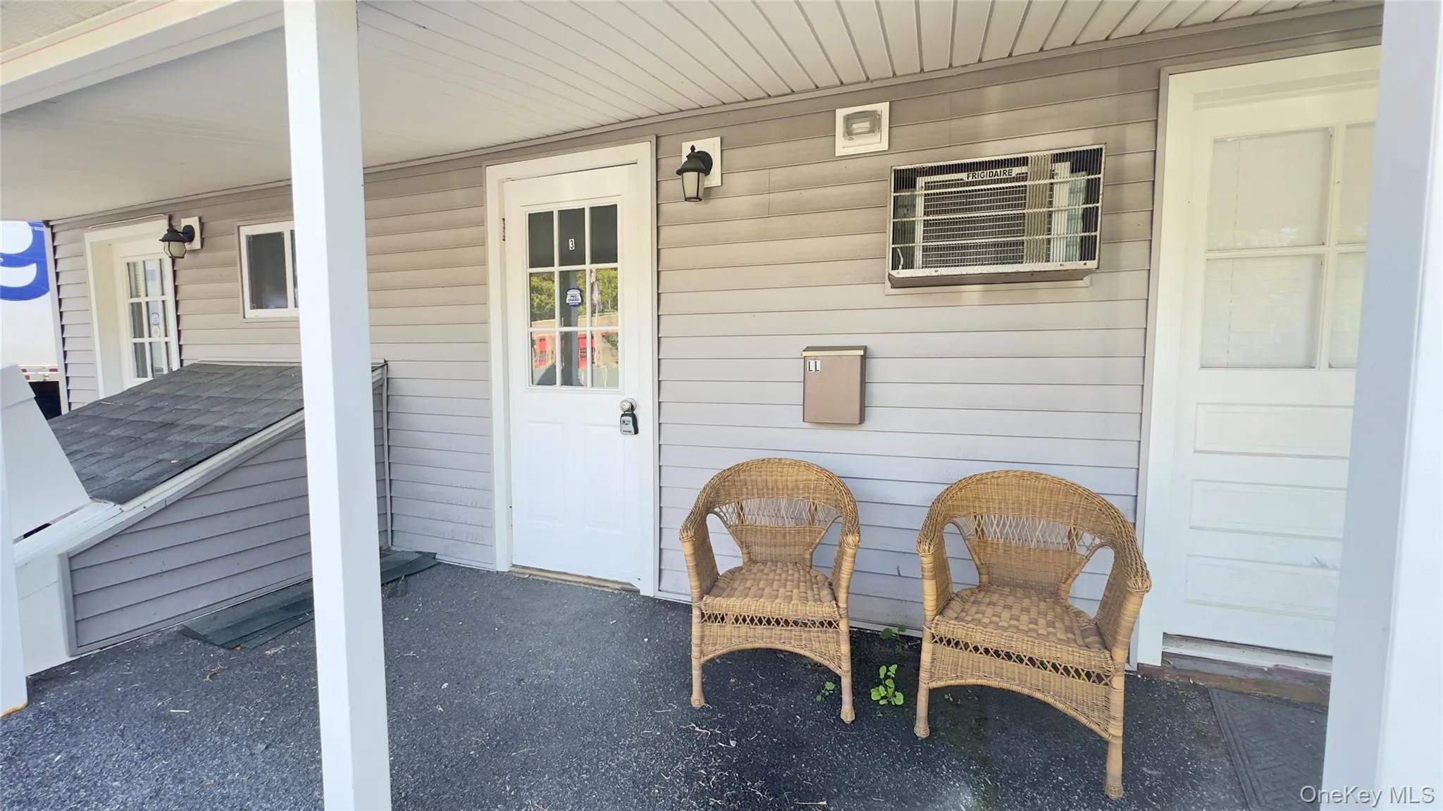 Doorway to property featuring a small patio area Doorway to property featuring a small patio area