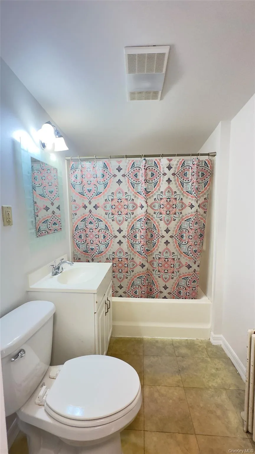 Bathroom with vanity, light tile patterned flooring, and shower / bathtub combination, toilet Bathroom with vanity, light tile patterned flooring, and shower / bathtub combination, toilet