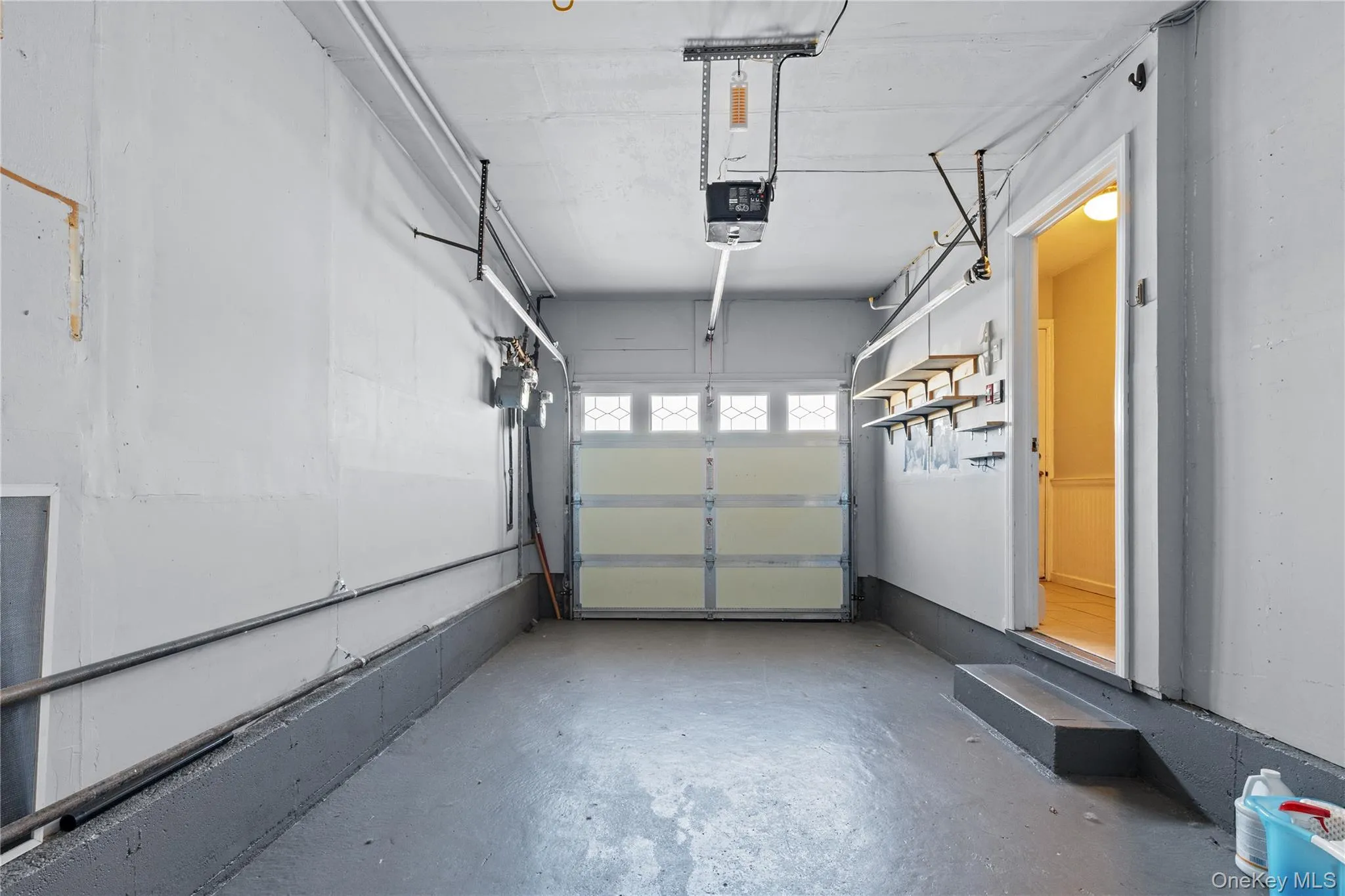 Garage featuring a garage door opener Garage featuring a garage door opener