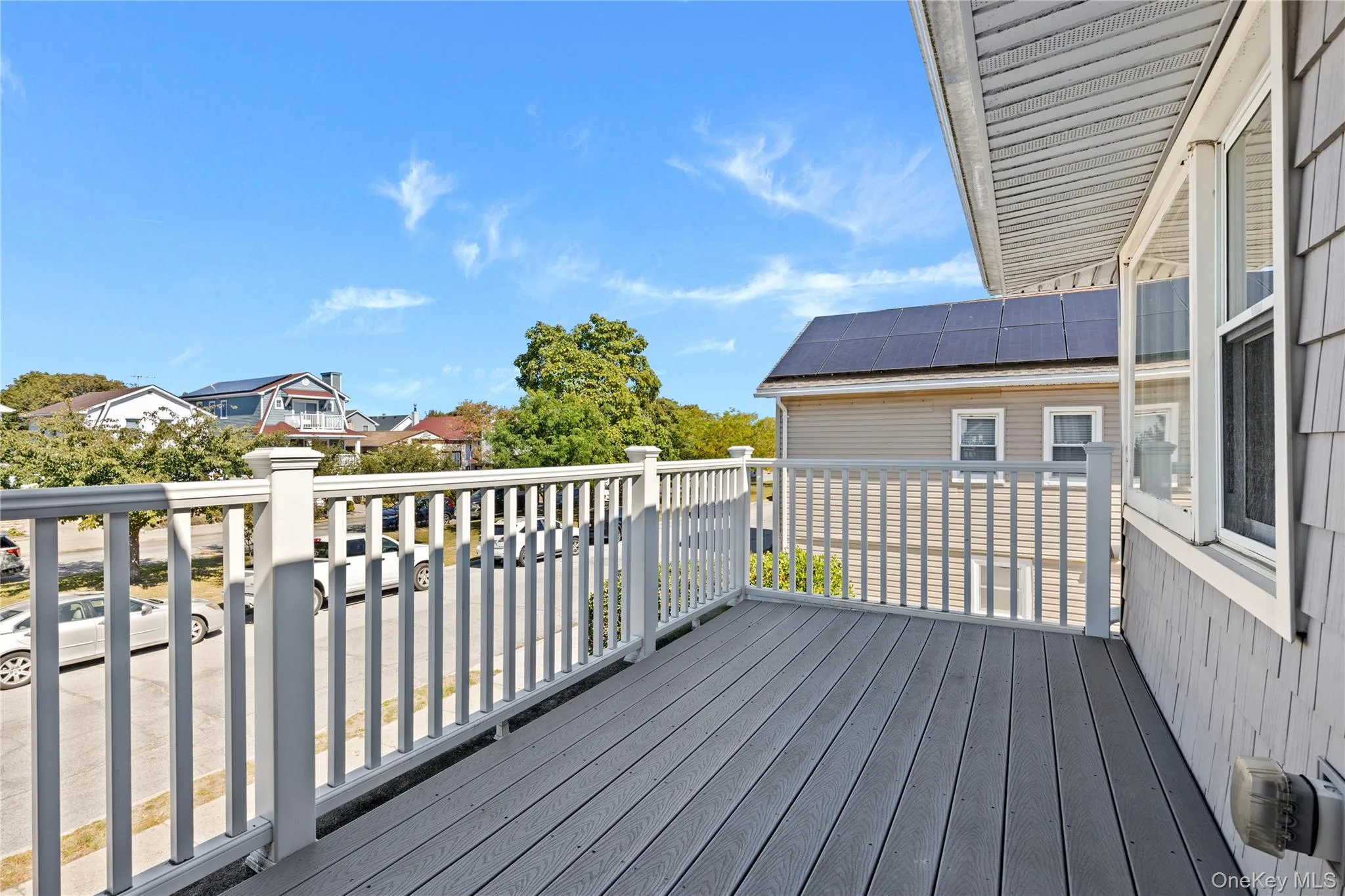Wooden deck featuring a residential view Wooden deck featuring a residential view