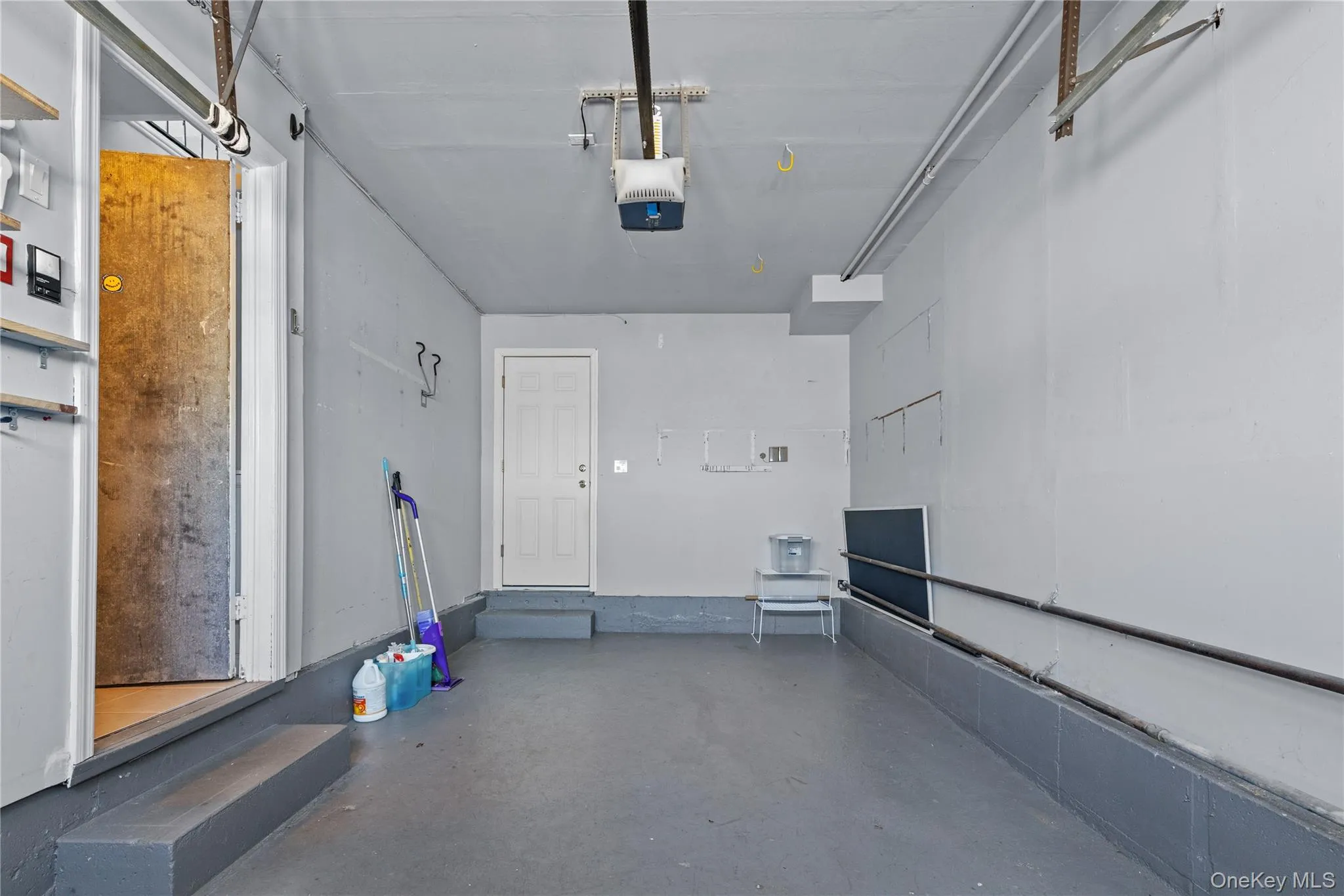 Garage featuring a garage door opener Garage featuring a garage door opener