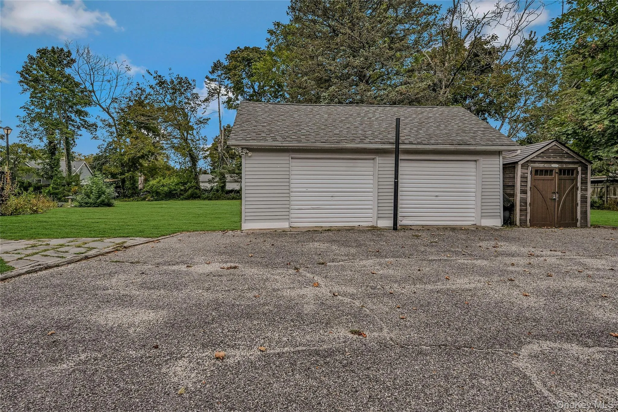 Detached garage featuring a shed Detached garage featuring a shed