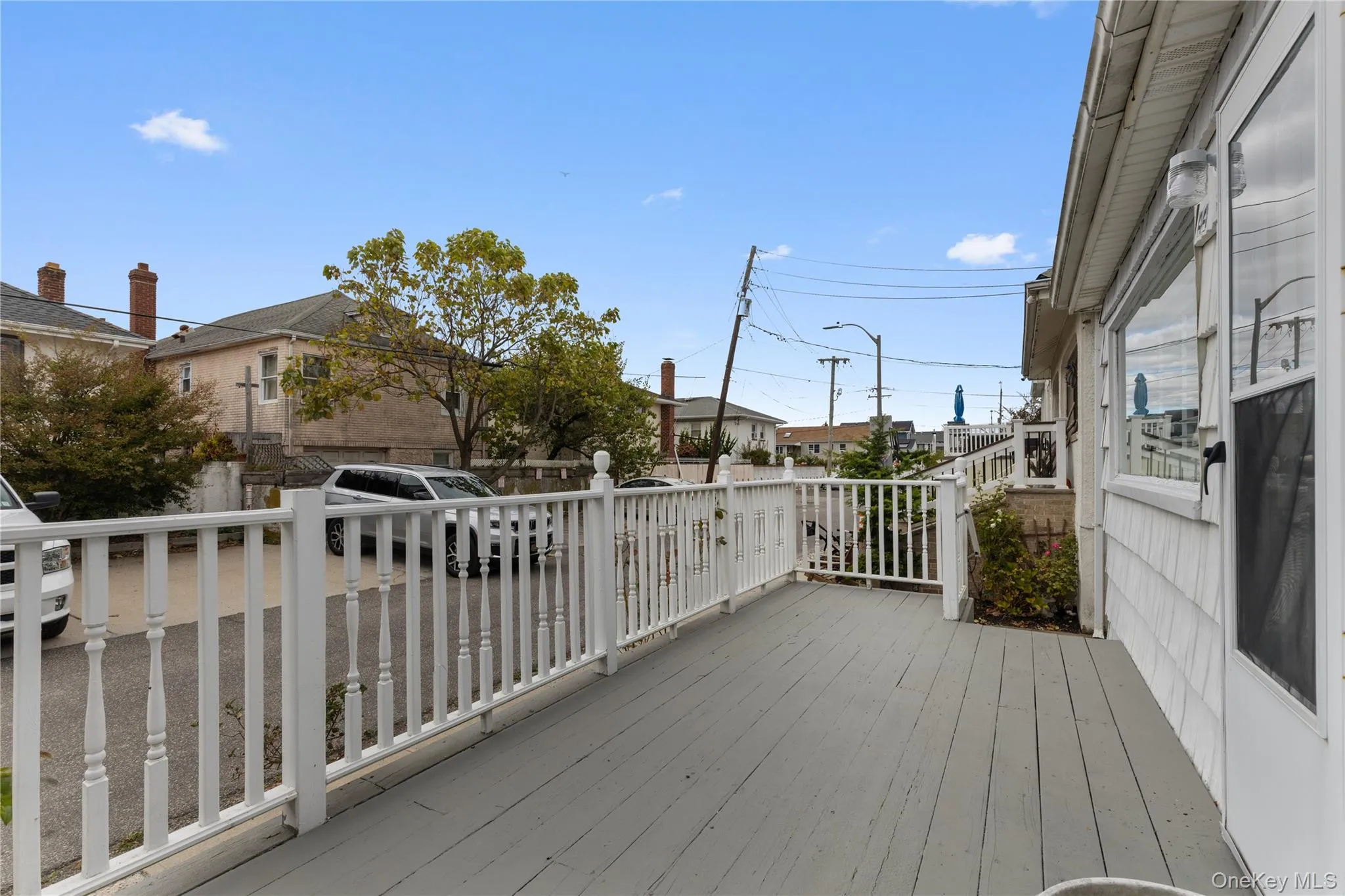 Wooden deck featuring a residential view Wooden deck featuring a residential view