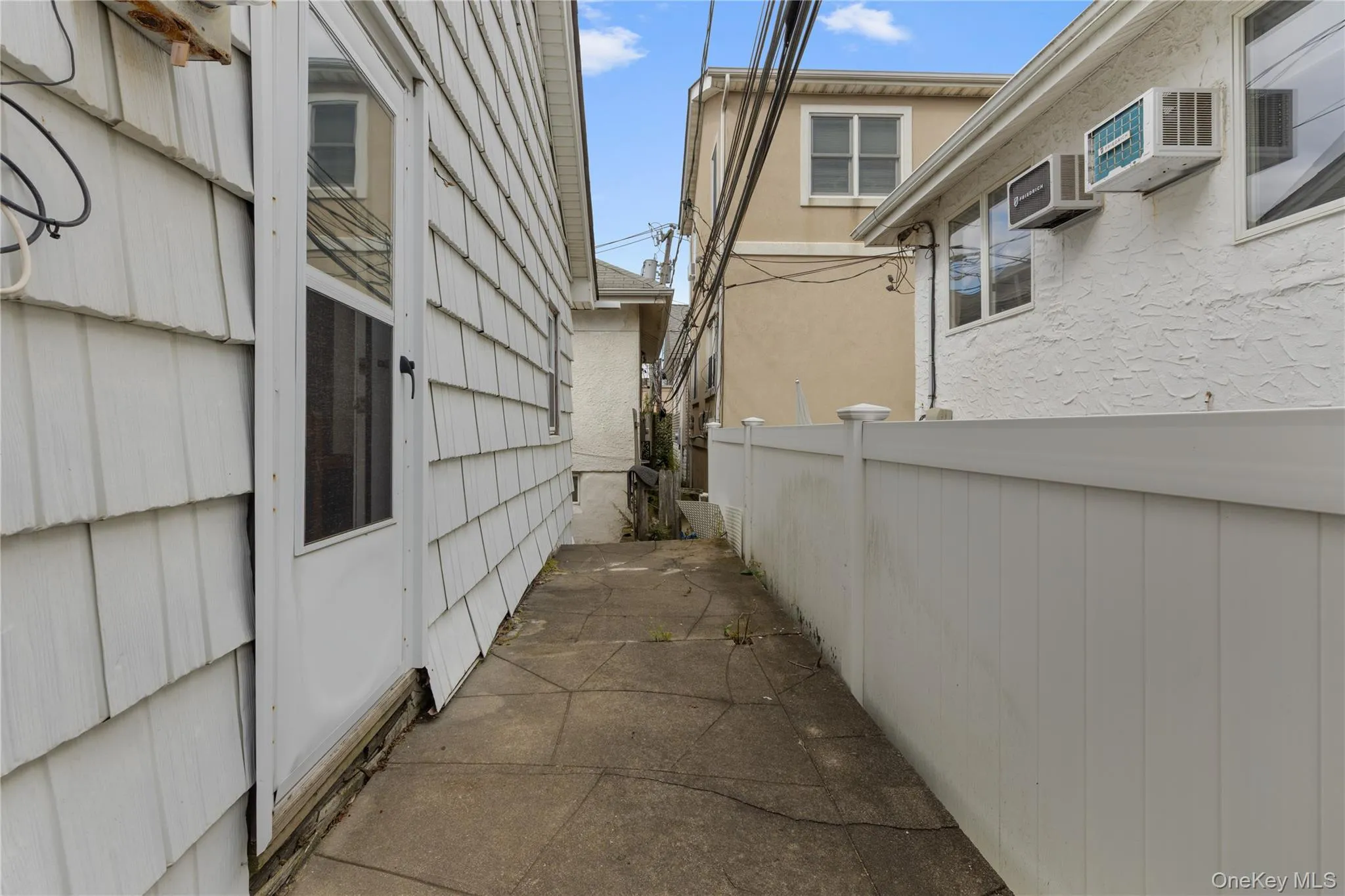 View of side of home featuring stucco siding View of side of home featuring stucco siding