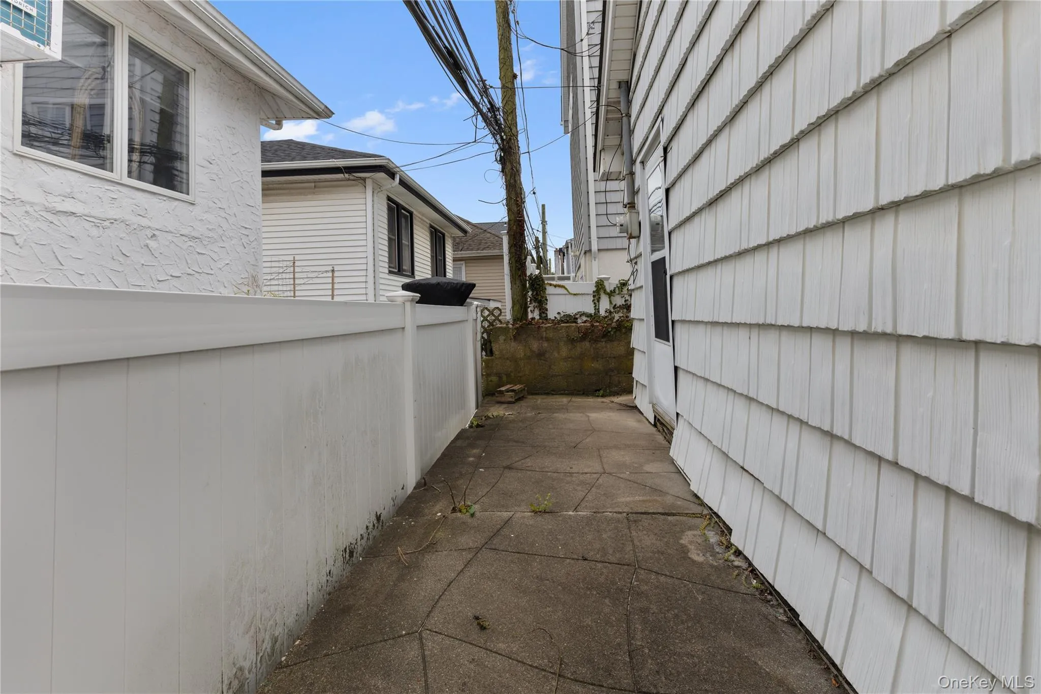 View of home's exterior featuring stucco siding View of home's exterior featuring stucco siding