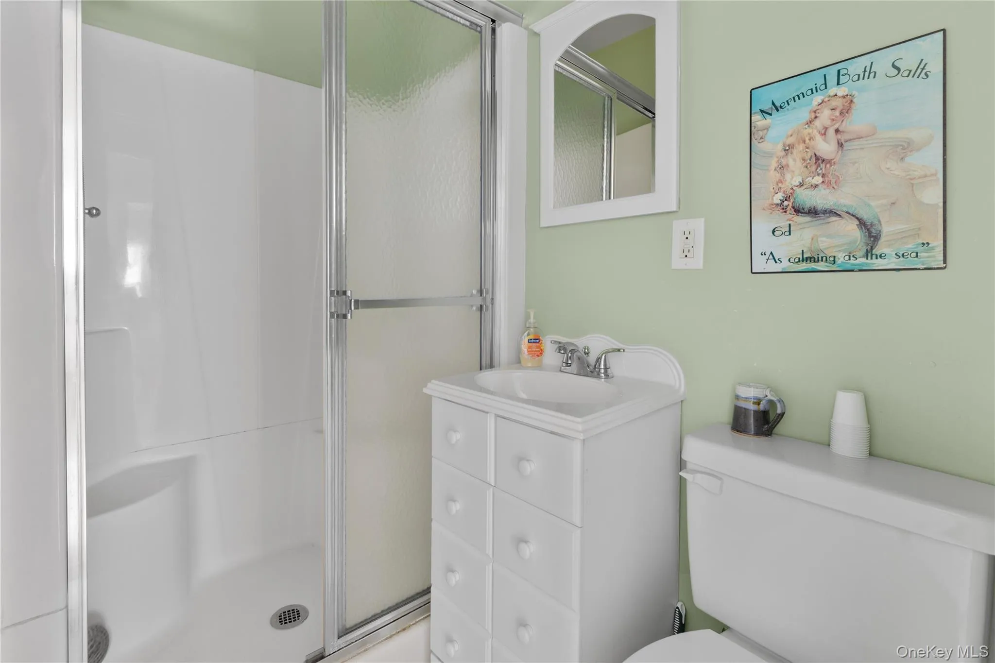Full bathroom with a stall shower and vanity Full bathroom with a stall shower and vanity