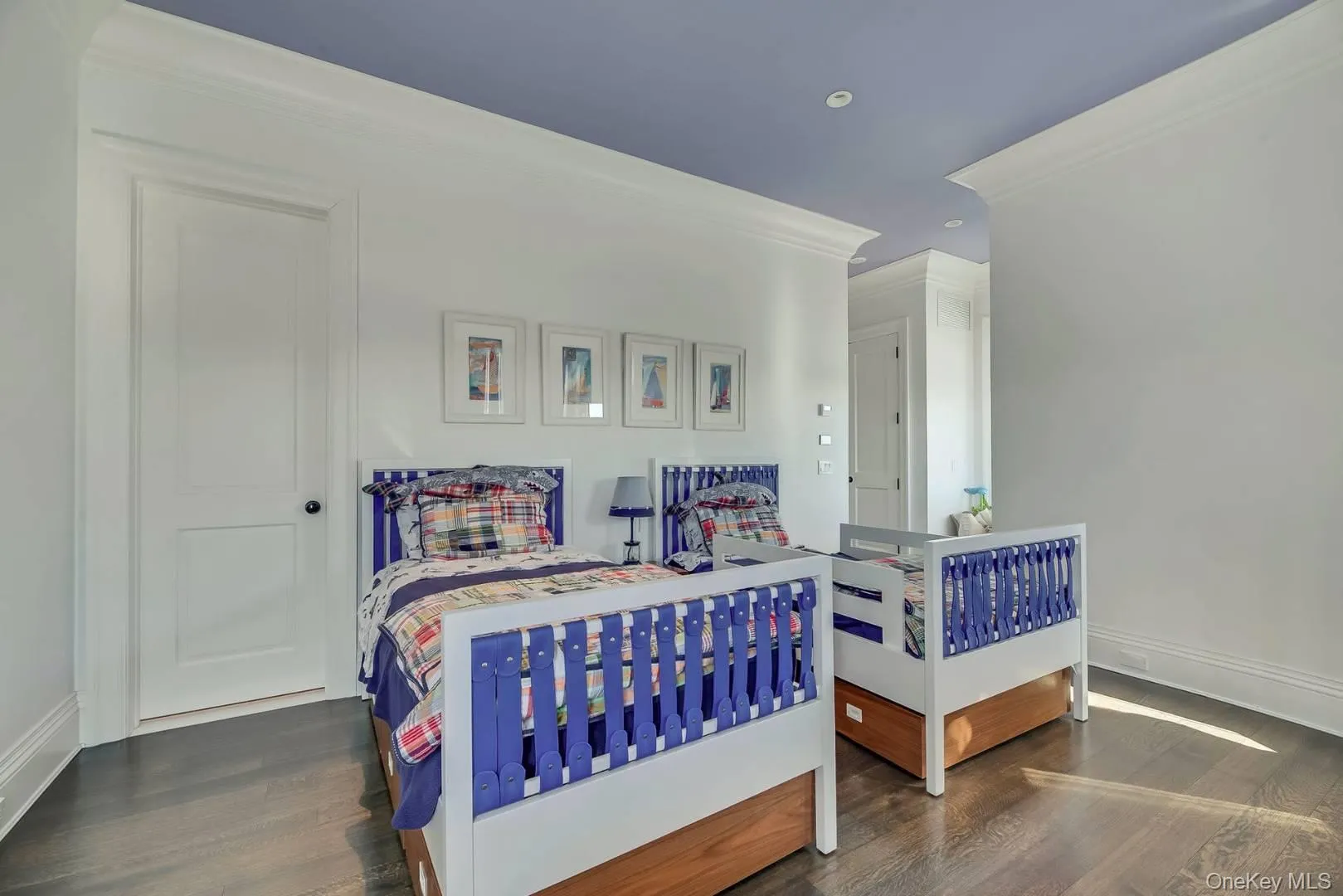 Bedroom featuring crown molding, dark wood-style flooring, and recessed lighting Bedroom featuring crown molding, dark wood-style flooring, and recessed lighting