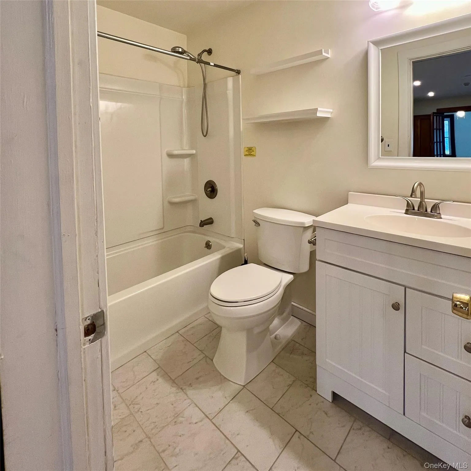 Bathroom featuring vanity, shower / bathtub combination. Bathroom featuring vanity, shower / bathtub combination.