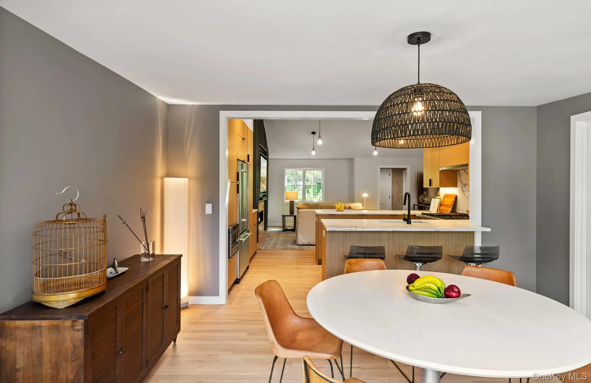 Dining space featuring light wood-style floors and baseboards Dining space featuring light wood-style floors and baseboards