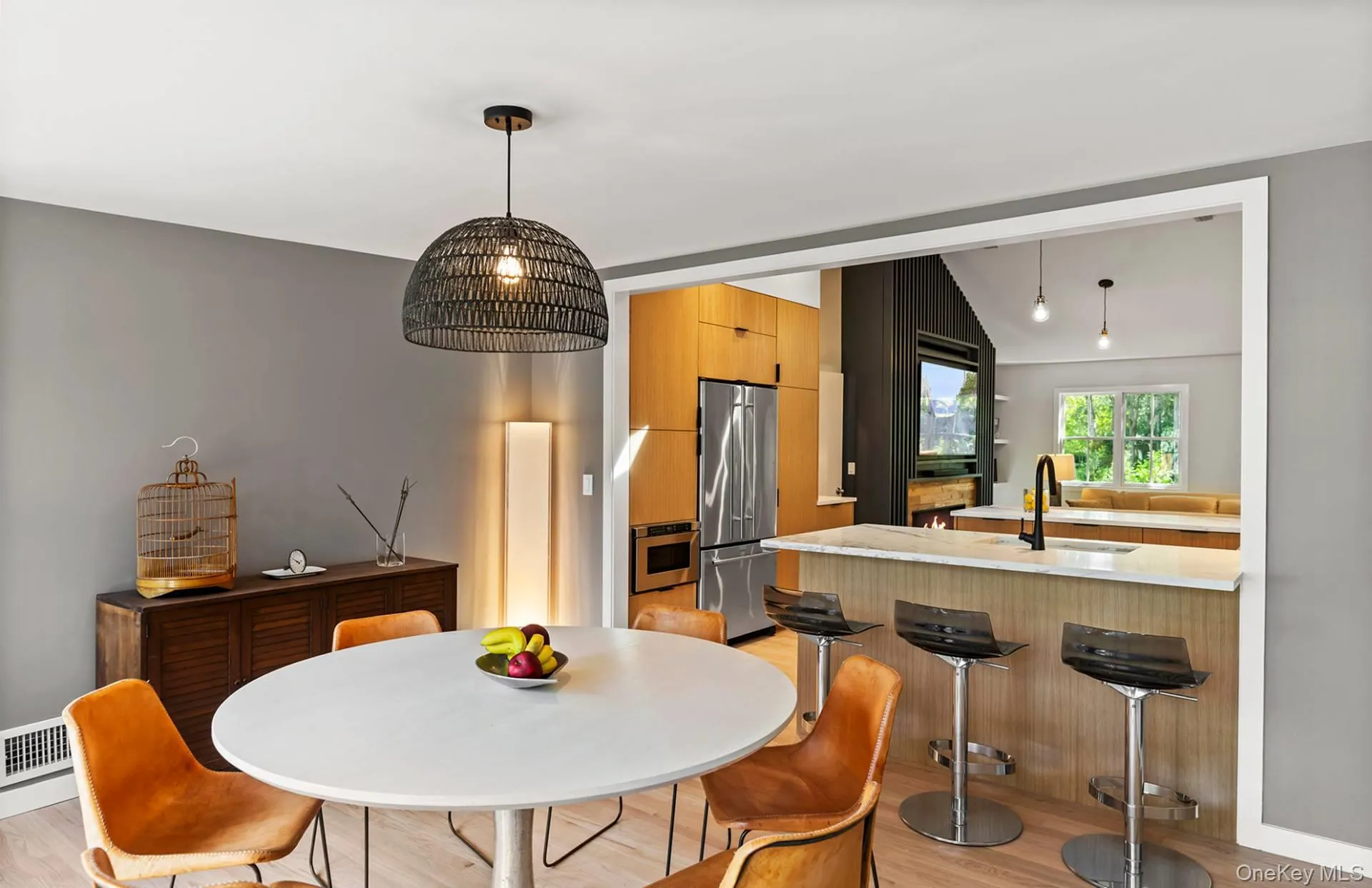 Dining area featuring lofted ceiling and light wood-style floors Dining area featuring lofted ceiling and light wood-style floors