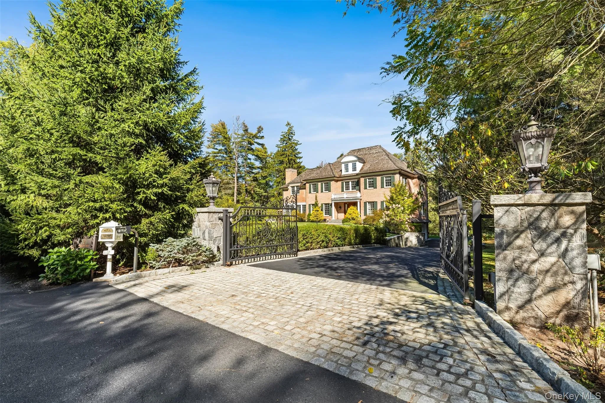 Privately gated with cobblestone apron and curbing Privately gated with cobblestone apron and curbing