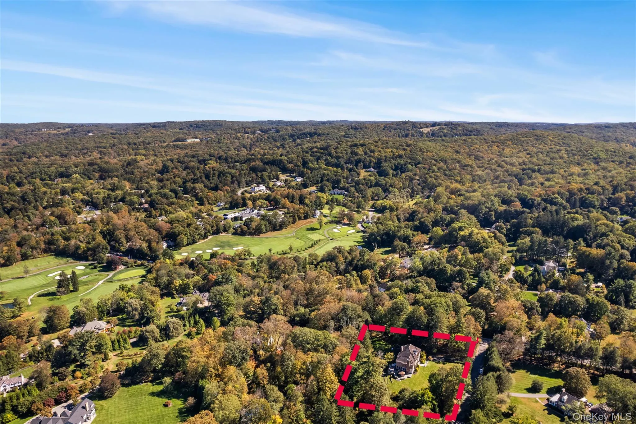 Aerial view of property's location with property boundaries highlighted and a forest Aerial view of property's location with property boundaries highlighted and a forest