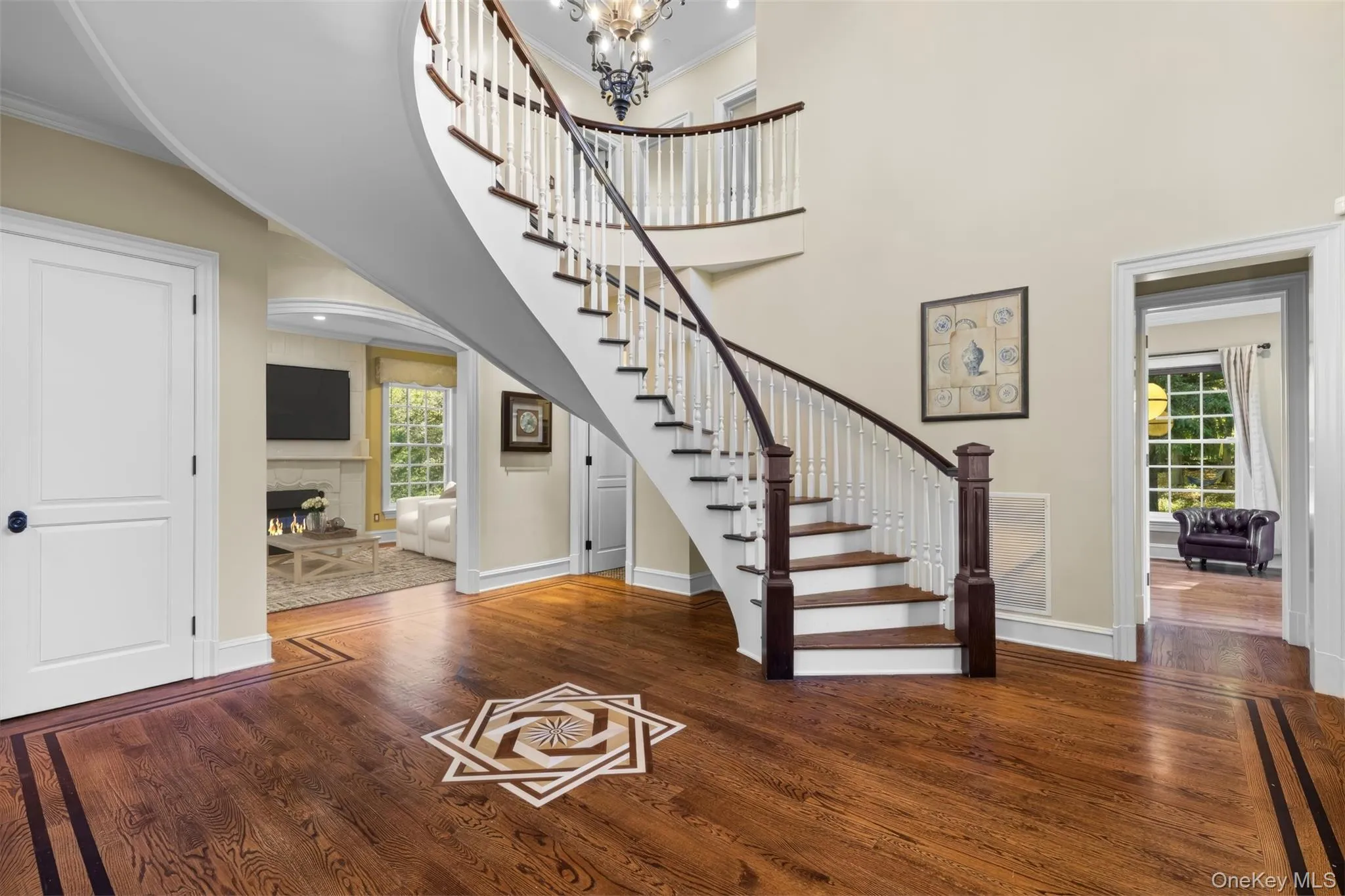 Entry foyer with a view of the first floor bedroom and living room. Virtually staged Entry foyer with a view of the first floor bedroom and living room. Virtually staged